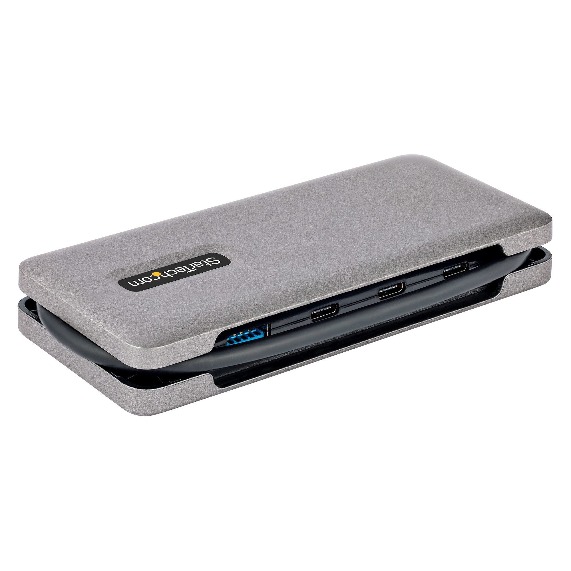 Una carcasa de disco duro externo Startech.com gris con varios puertos.