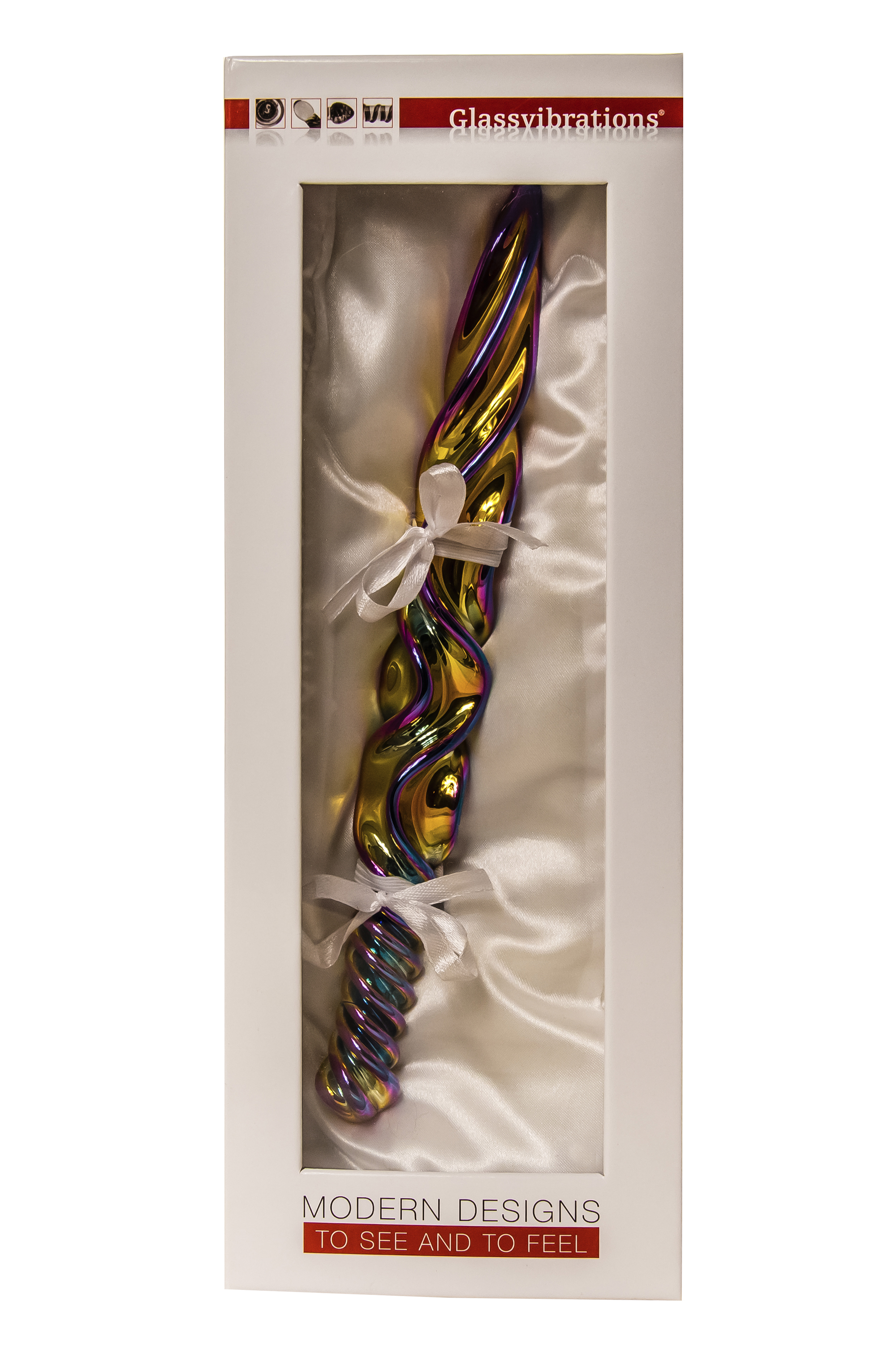 Ein farbenfroher, schillernder Glasvibrator wird in einer weißen Schachtel mit Schleifen präsentiert. Auf der Schachtel steht 'Modern Designs'.