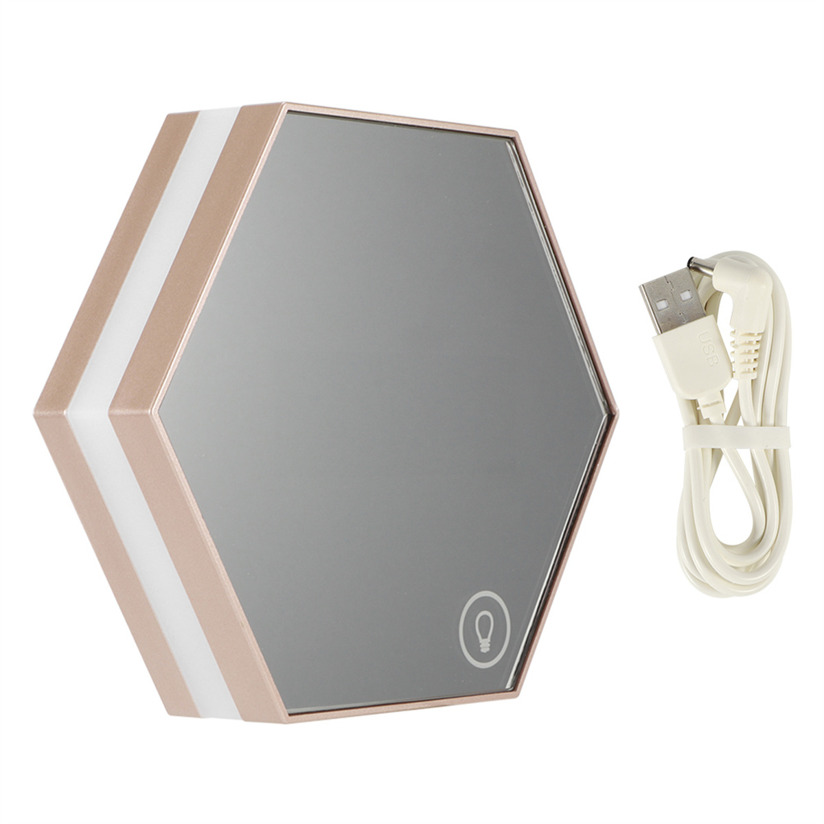 Ein sechseckiger Spiegel mit weißen und roségoldenen Akzenten sowie ein USB-Ladekabel.