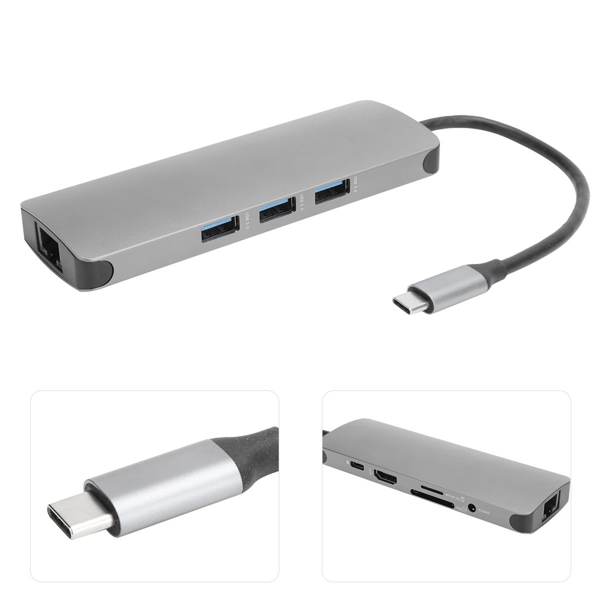 Ein silberner USB-Hub mit mehreren USB-Anschlüssen, einem USB-C-Anschluss und einem schwarzen USB-Kabel.
