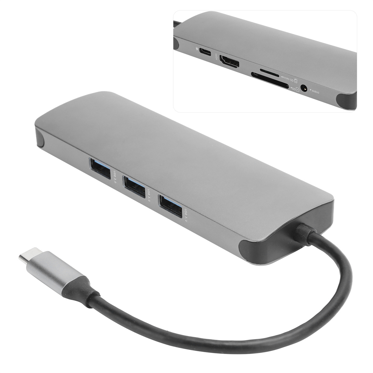 Ein grauer USB-Hub mit mehreren Anschlüssen. Ein Kabel ist an den Hub angeschlossen.
