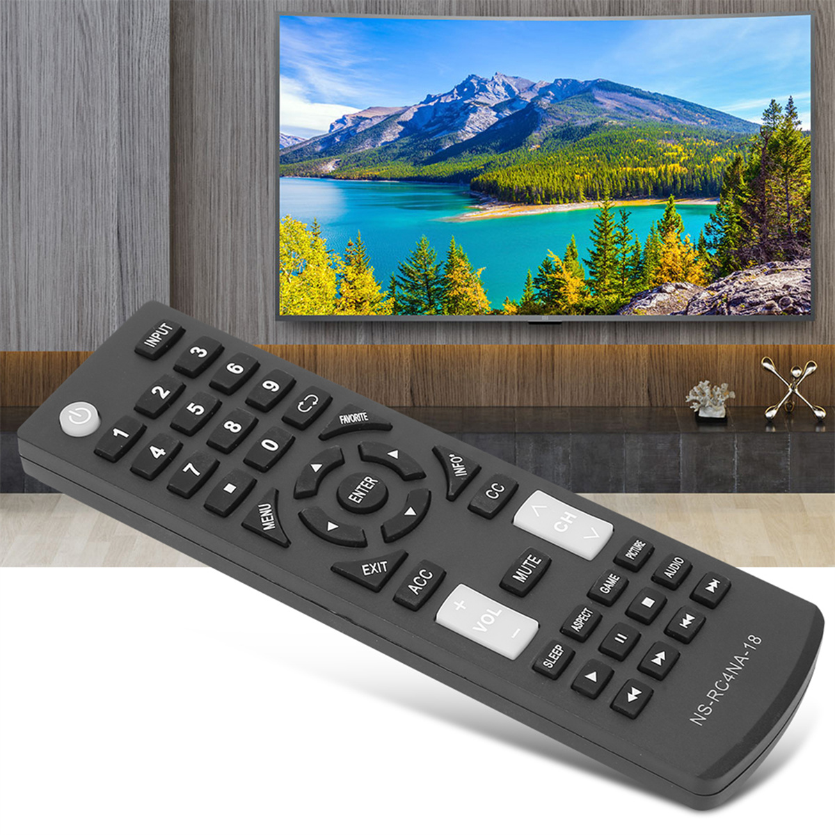 Eine schwarze TV-Fernbedienung mit vielen Tasten vor einem Fernseher, der eine malerische Landschaft zeigt.