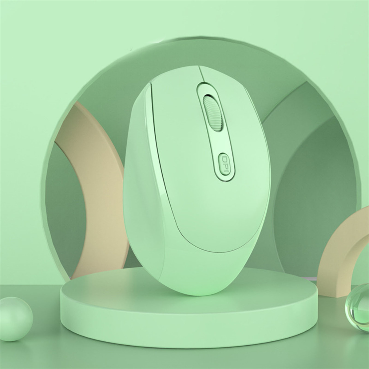 Eine mintgrüne kabellose Maus auf einer mintgrünen Plattform vor mintgrünem Hintergrund.