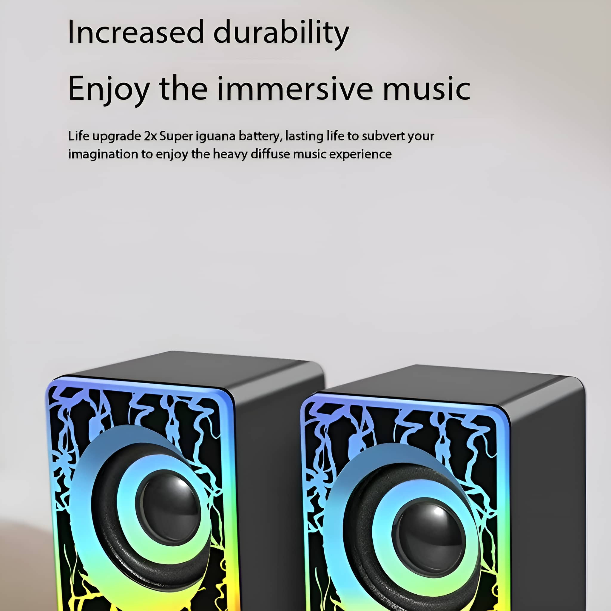 Zwei schwarze Lautsprecher mit farbenfrohen Lichtdesigns auf weißem Hintergrund. Text über Musik.