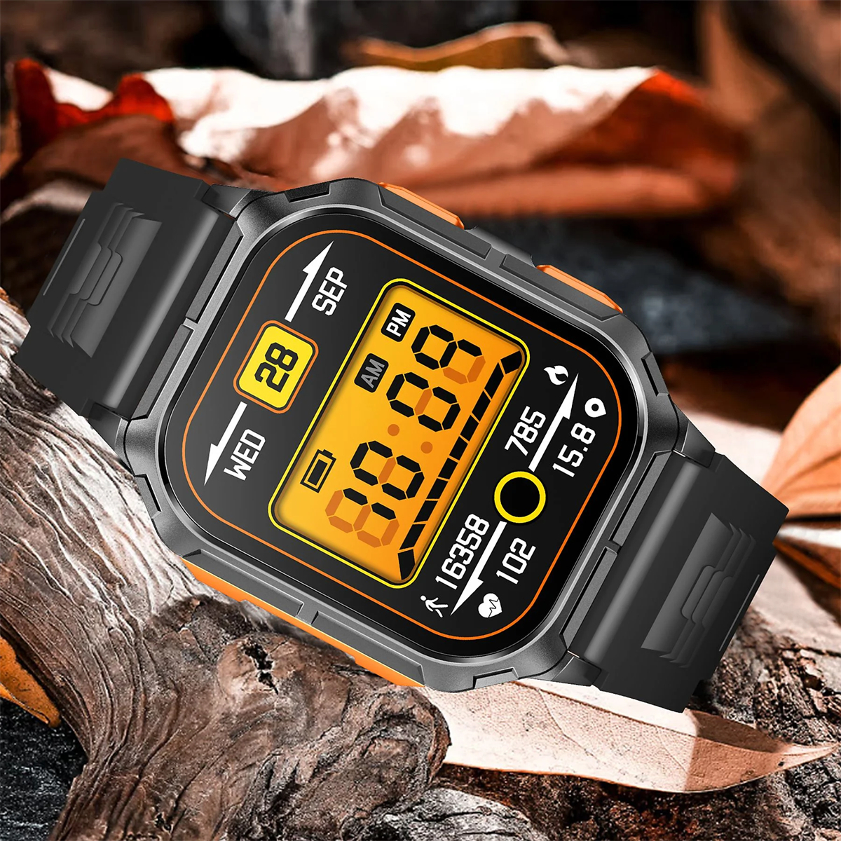 Eine schwarze Smartwatch mit orangefarbenem Rand, die Zeit und Datum anzeigt, auf Blättern liegend.