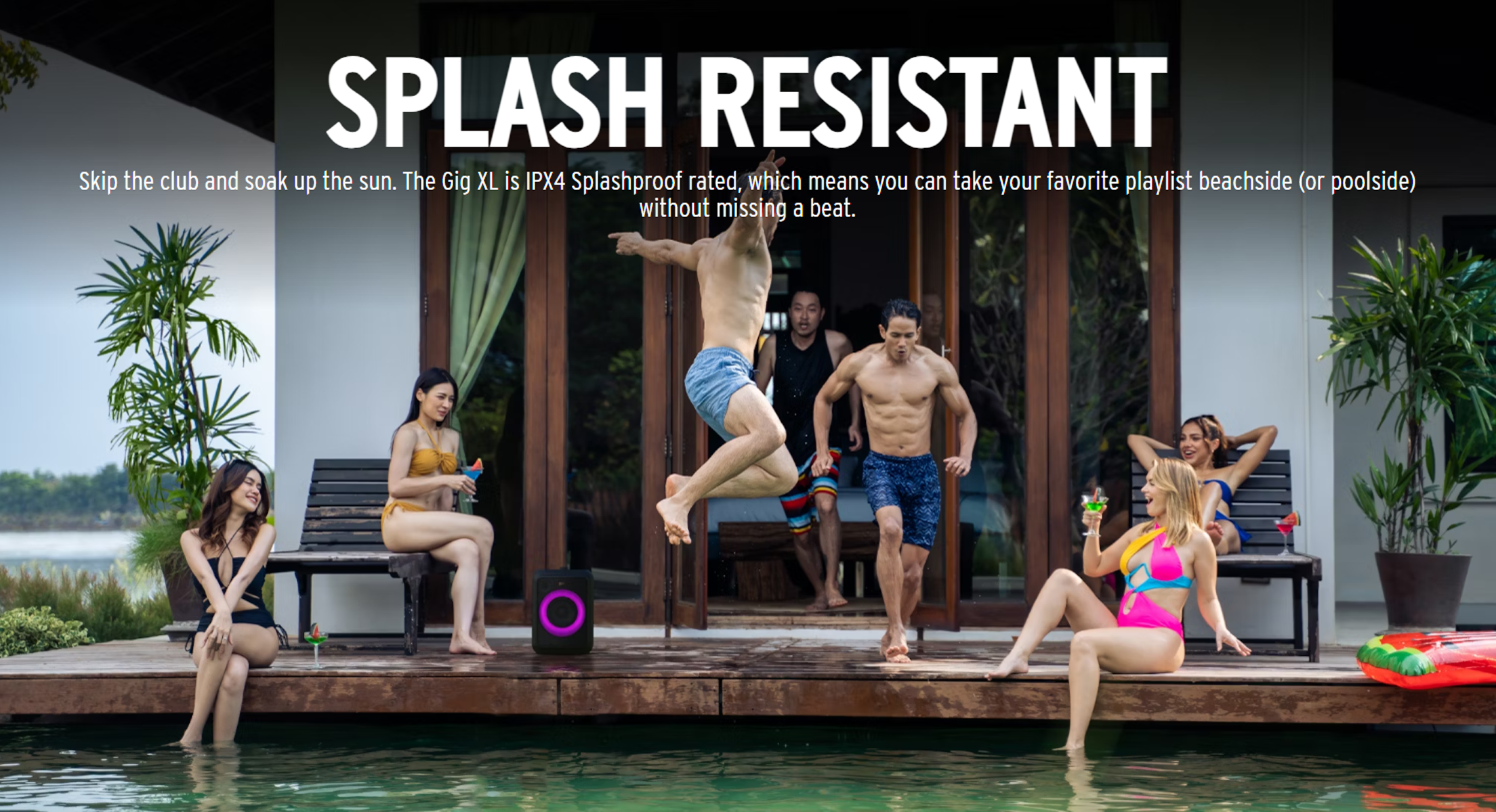 People at a pool party. A speaker is in the foreground. Text states it is splash resistant.
