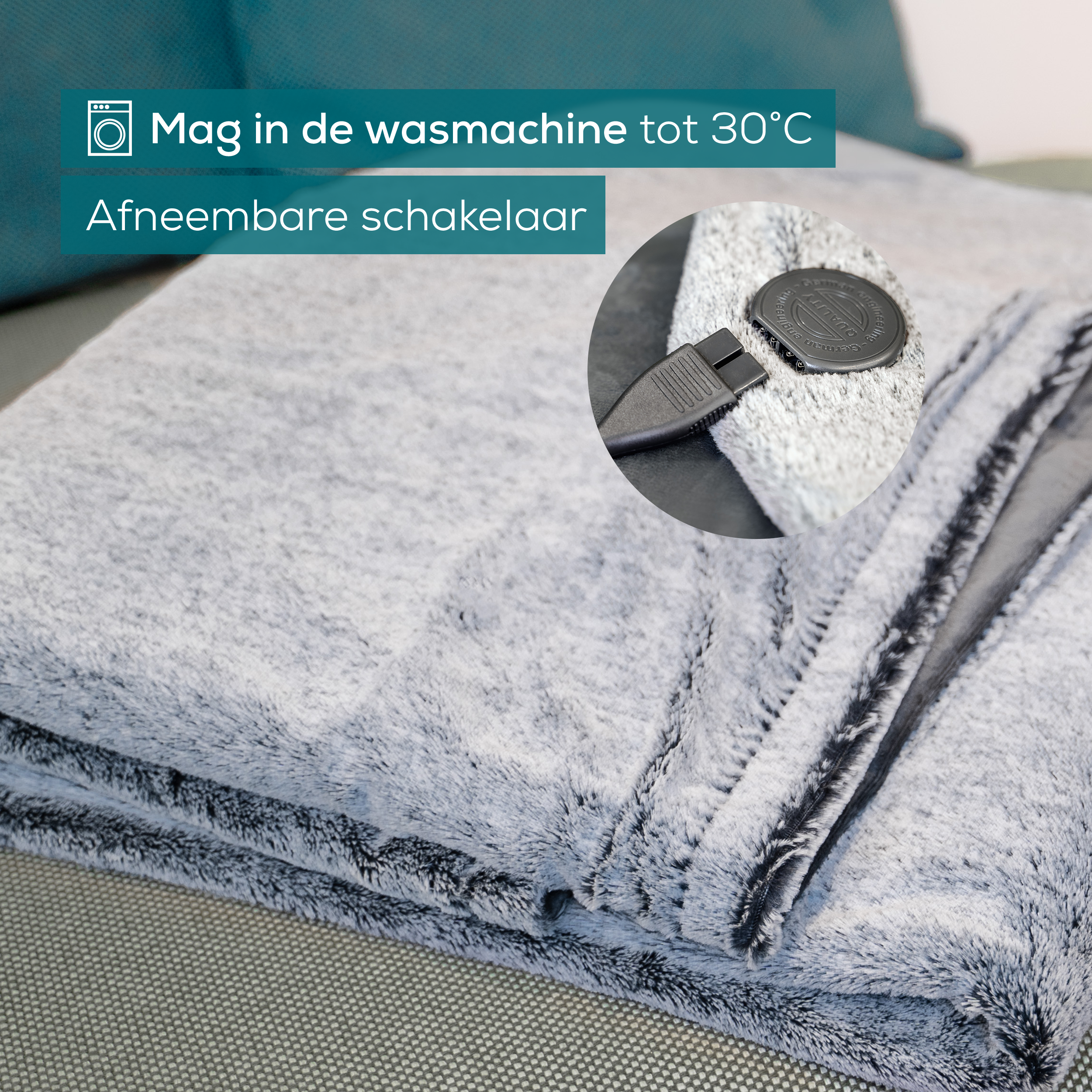 Graue Decke mit abnehmbarem Schalter. Text: Maschinenwäsche bis 30°C.