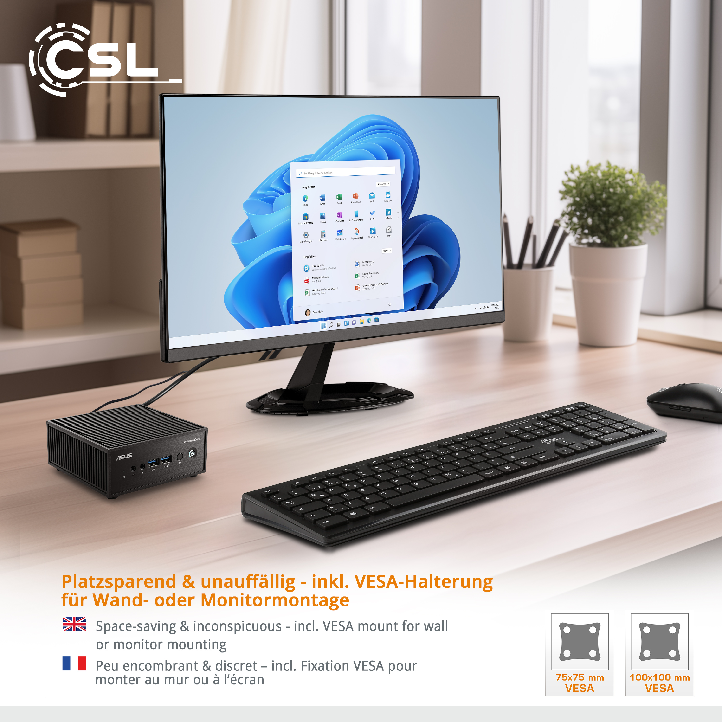 Computer-Setup: Monitor, Tastatur, kleiner PC und Maus auf einem Holztisch.
