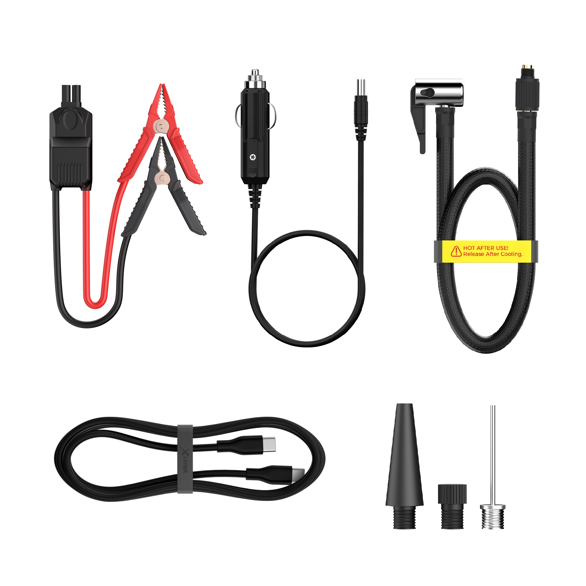 Verschiedenes Autozubehör, darunter ein Netzkabel, Überbrückungskabel und Reifenfüller.