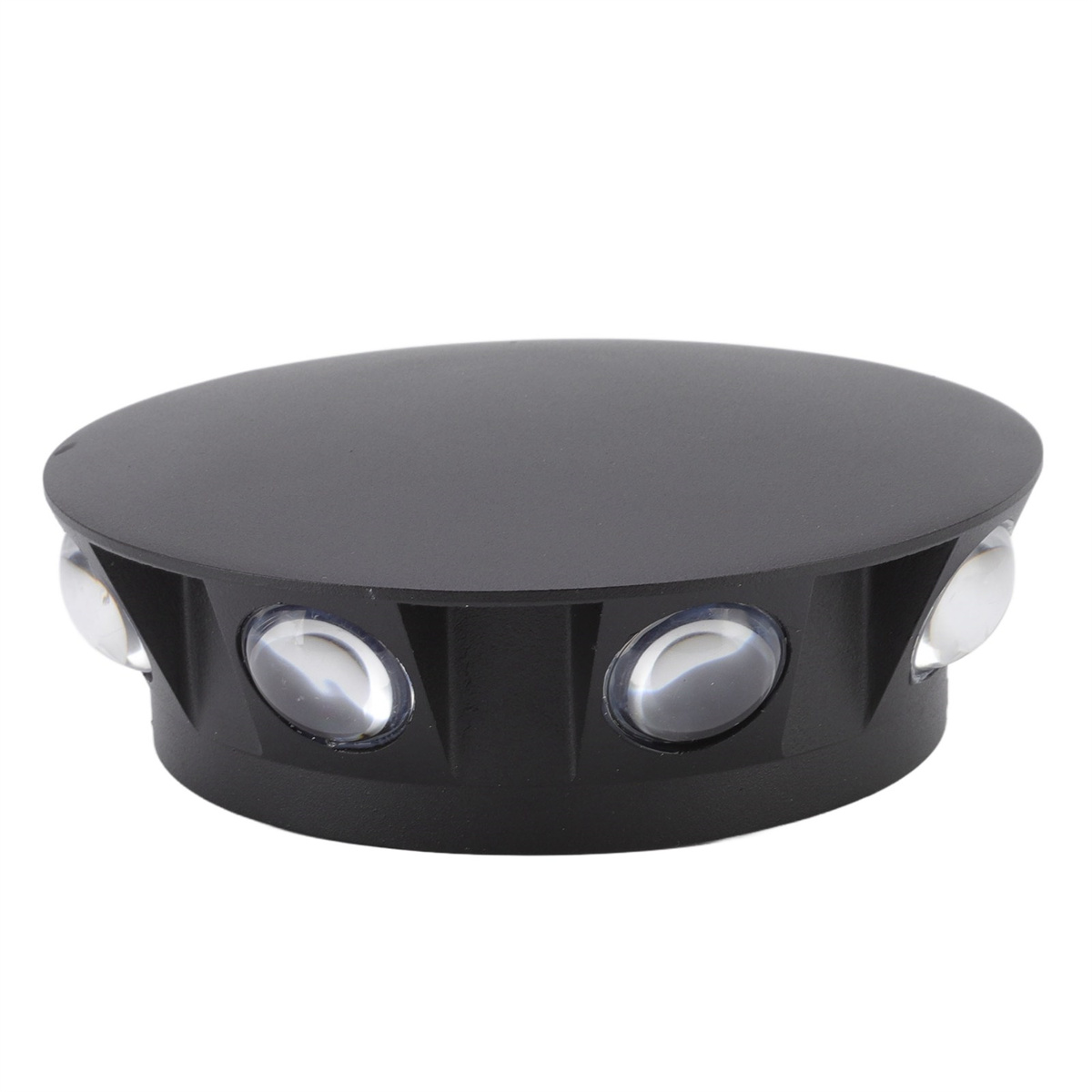 Ein schwarzes Gerät mit vier klaren, oval geformten Lichtern oben. Es hat eine abgerundete Form.