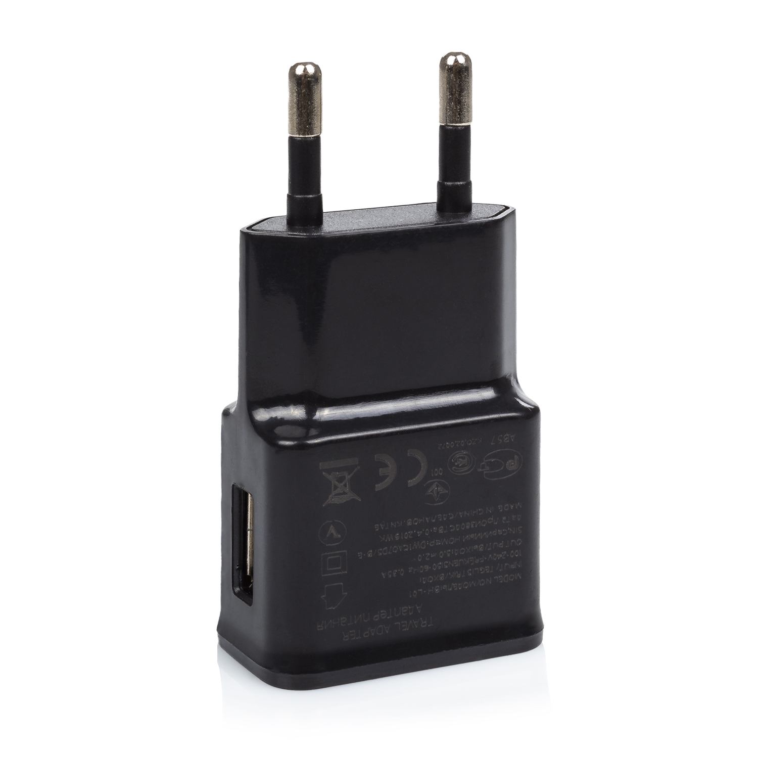 Adattatore da viaggio nero con due spine dorate e una porta USB. Sfondo bianco.