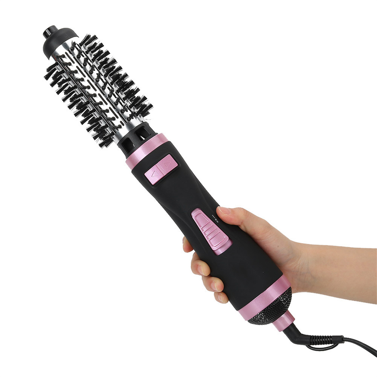 Haarstylingbürste in der Hand. Schwarz und rosa mit Borsten und Netzkabel.