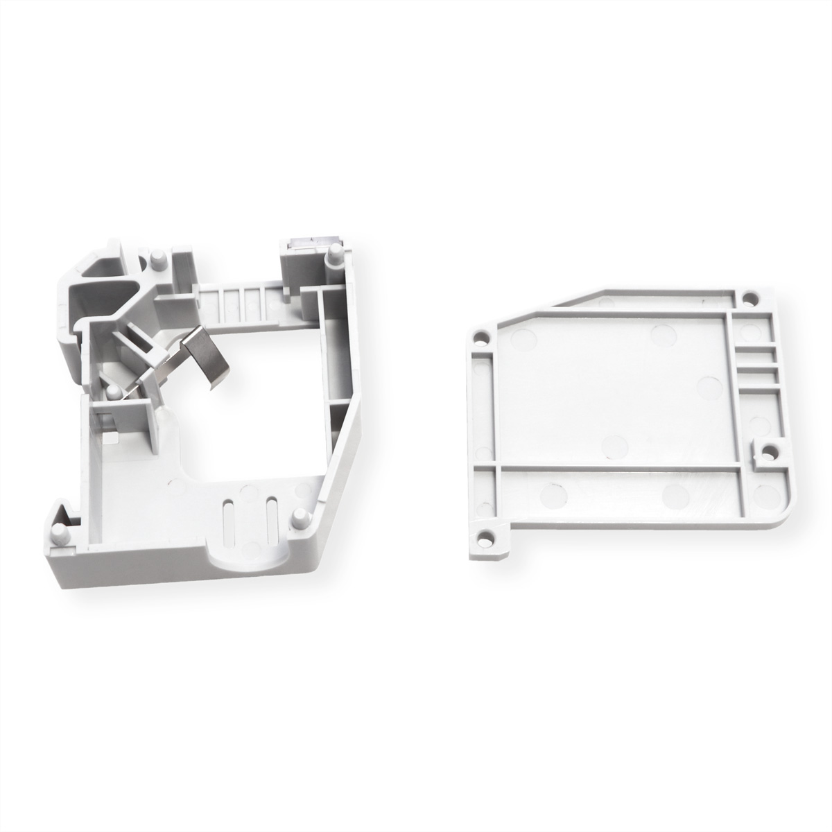 Pièces en plastique blanc avec une base rectangulaire. L'une a des découpes.
