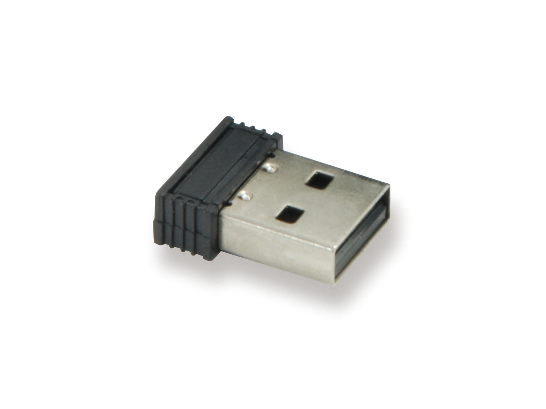 Un pequeño receptor USB, parte superior negra y cuerpo plateado, sobre una superficie blanca.