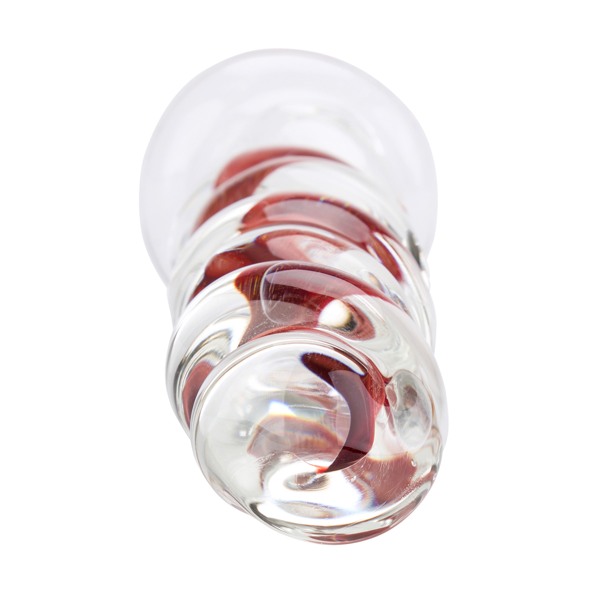 Ein Glasobjekt mit klarer Außenseite und rotem, spiralförmigem Innendesign. Es befindet sich auf weißem Hintergrund.