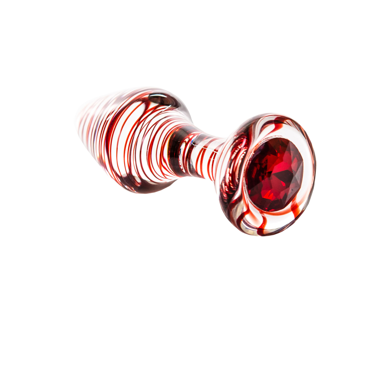 Glas-Butt-Plug mit roten Wirbeln und Edelstein. Liegt auf weißem Hintergrund.