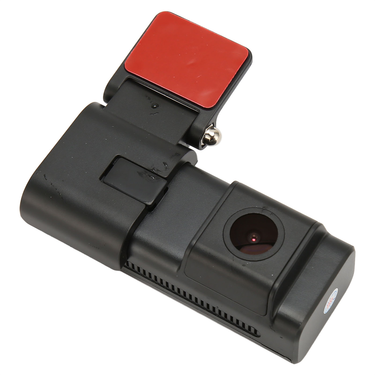 Schwarze Dashcam mit roter Klebehalterung auf weißer Oberfläche.