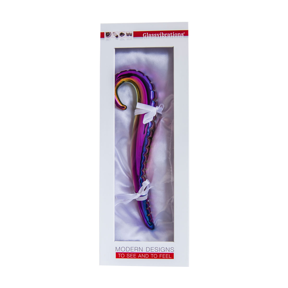 Ein farbenfroher Glasvibrator in einer weißen Box mit Satin-Innenausstattung und Schleife.