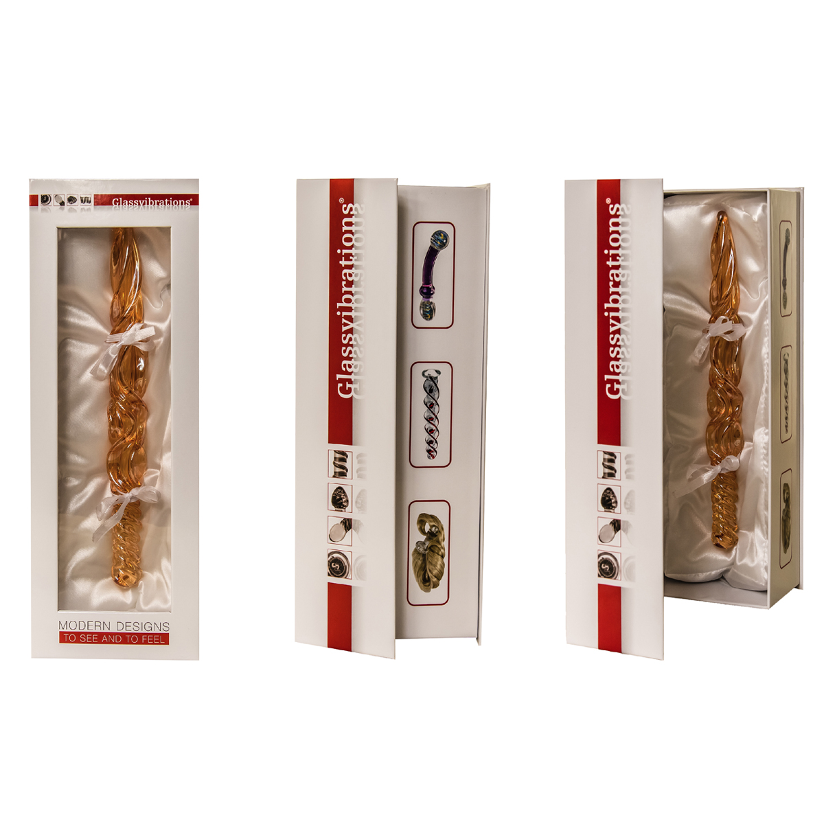 Drei verpackte Glasvibratoren, goldfarben, in weißen Boxen mit Satin.
