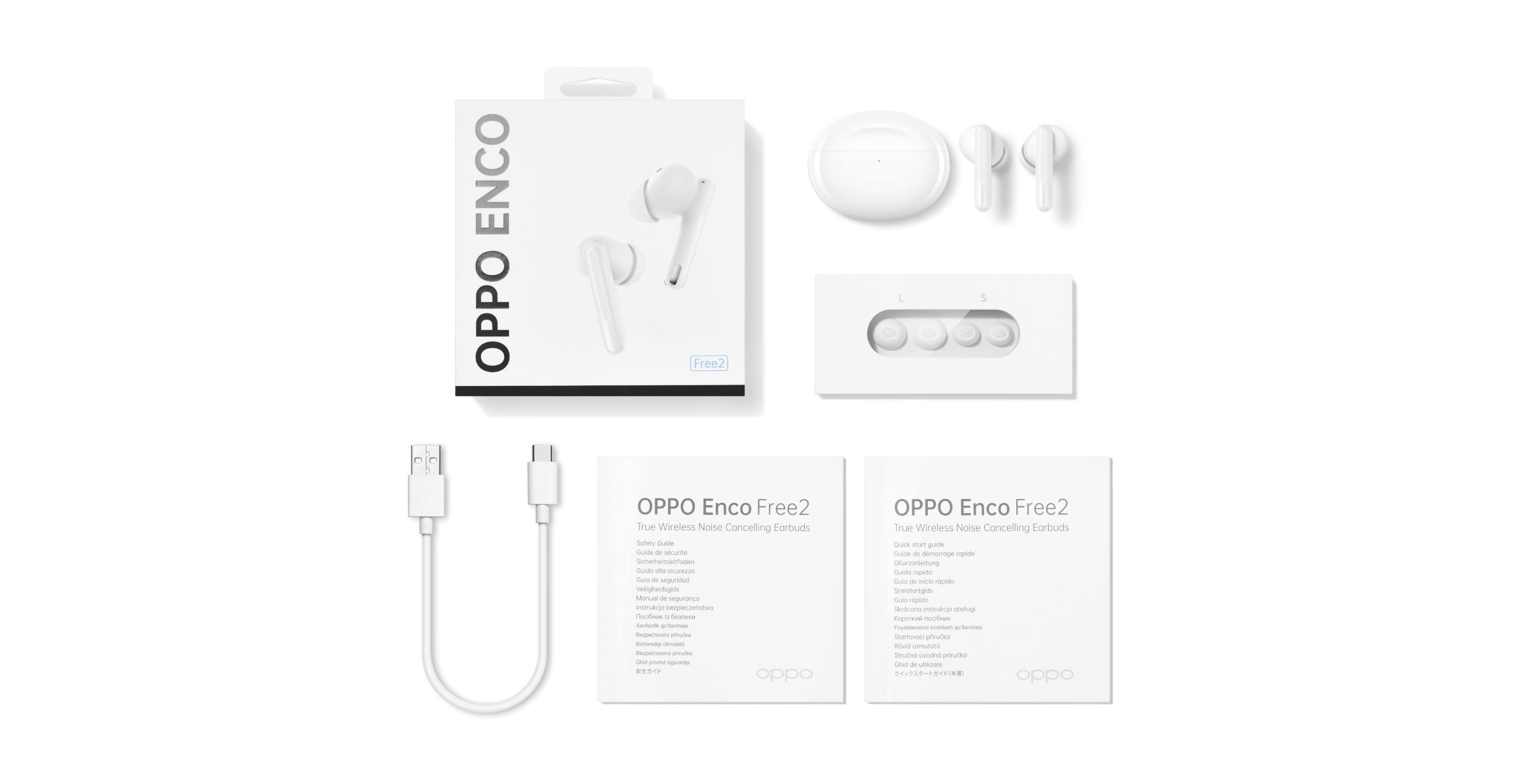 White Oppo Enco Free2 earbuds and charging case with accessories and packaging on a white surface.