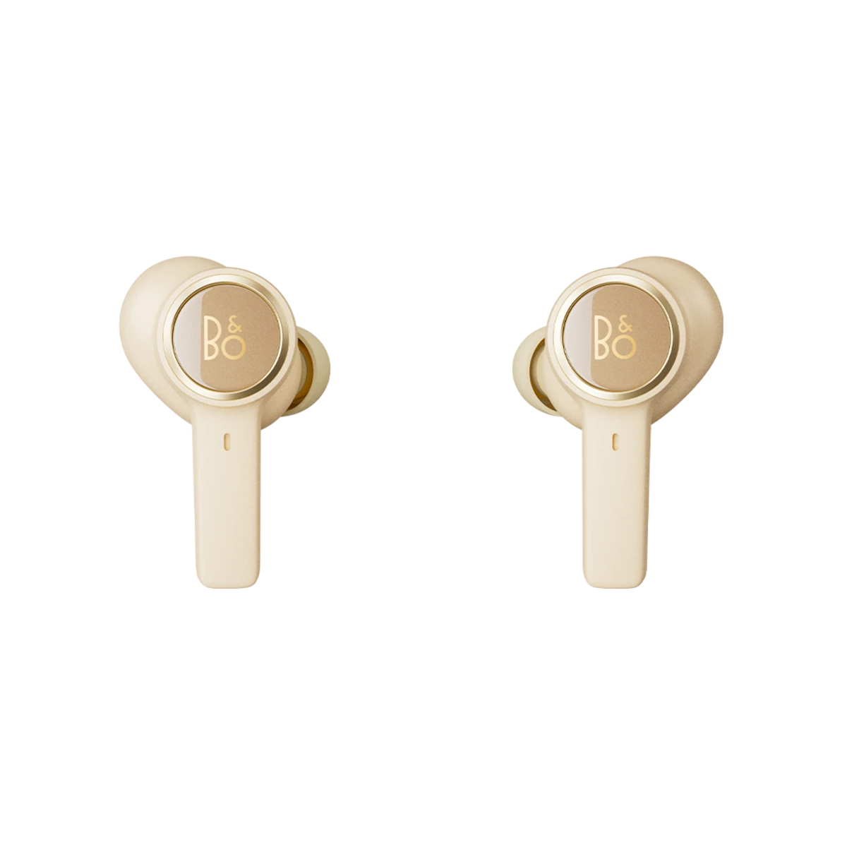 Two beige earbuds with gold accents. The earbuds have the 'B&O' logo.