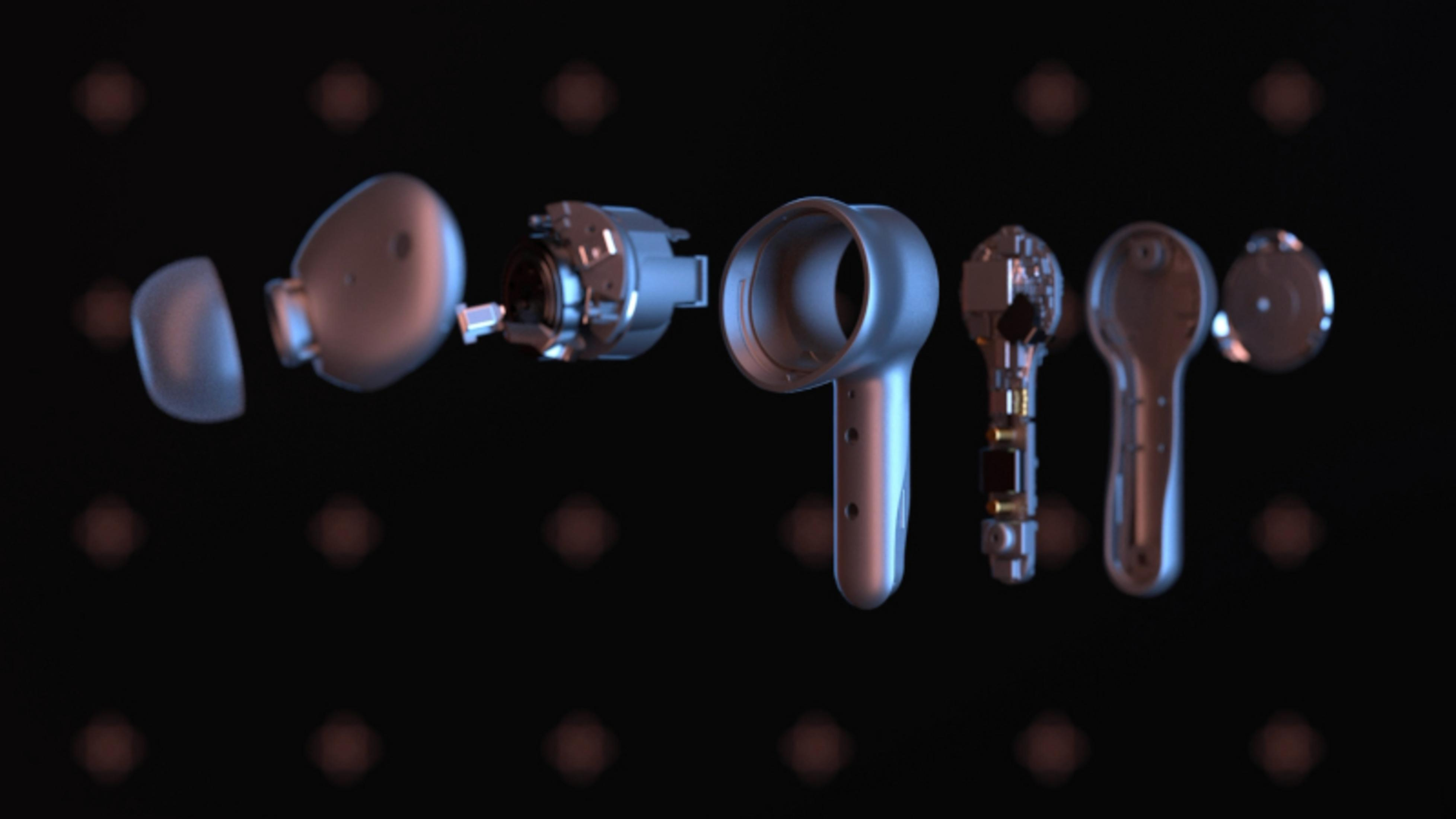 Widok rozstrzelony słuchawek dousznych na czarnym tle z kropkami światła.