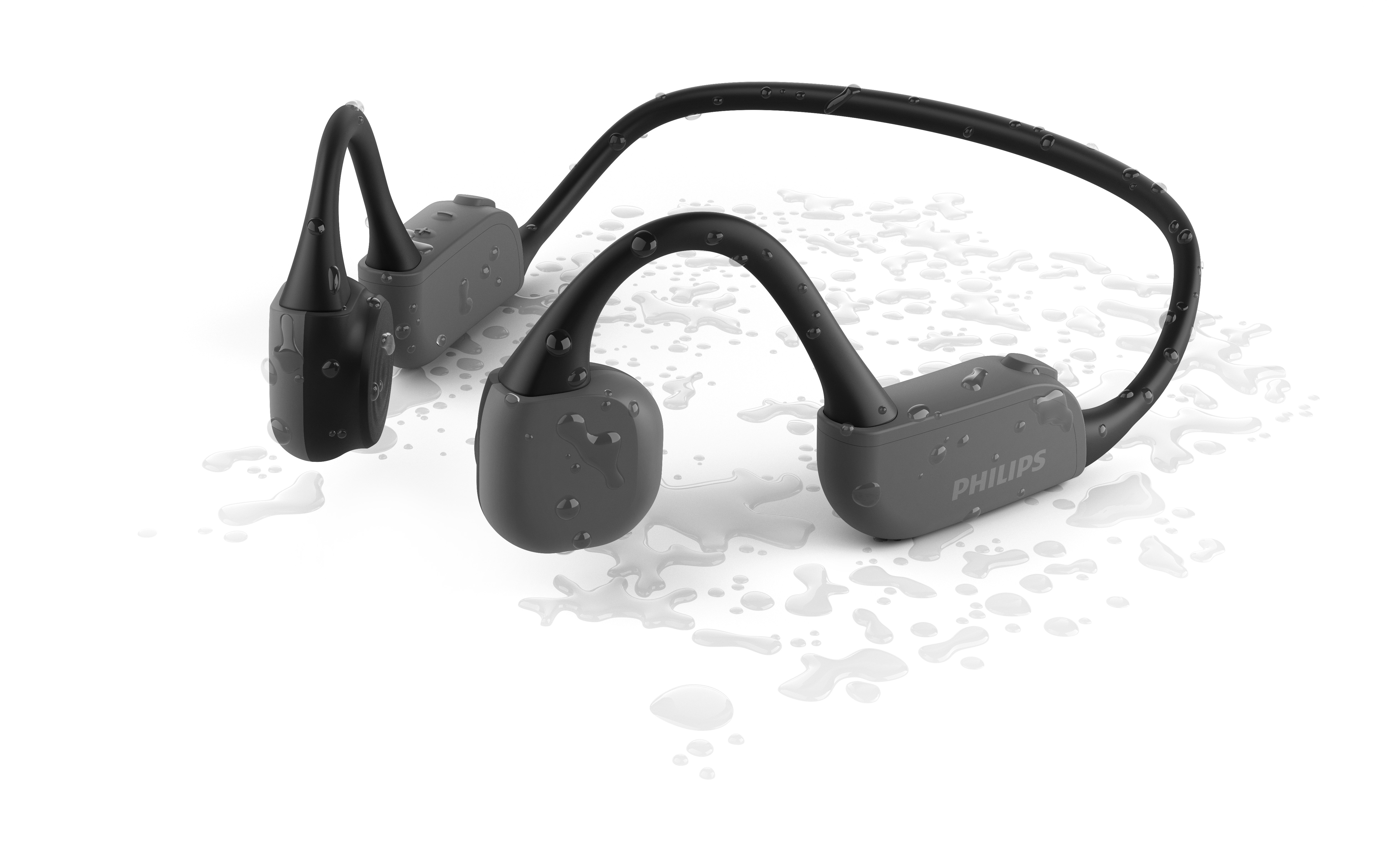 Auriculares de conducción ósea Philips negros, grises y rojos con gotas de agua.