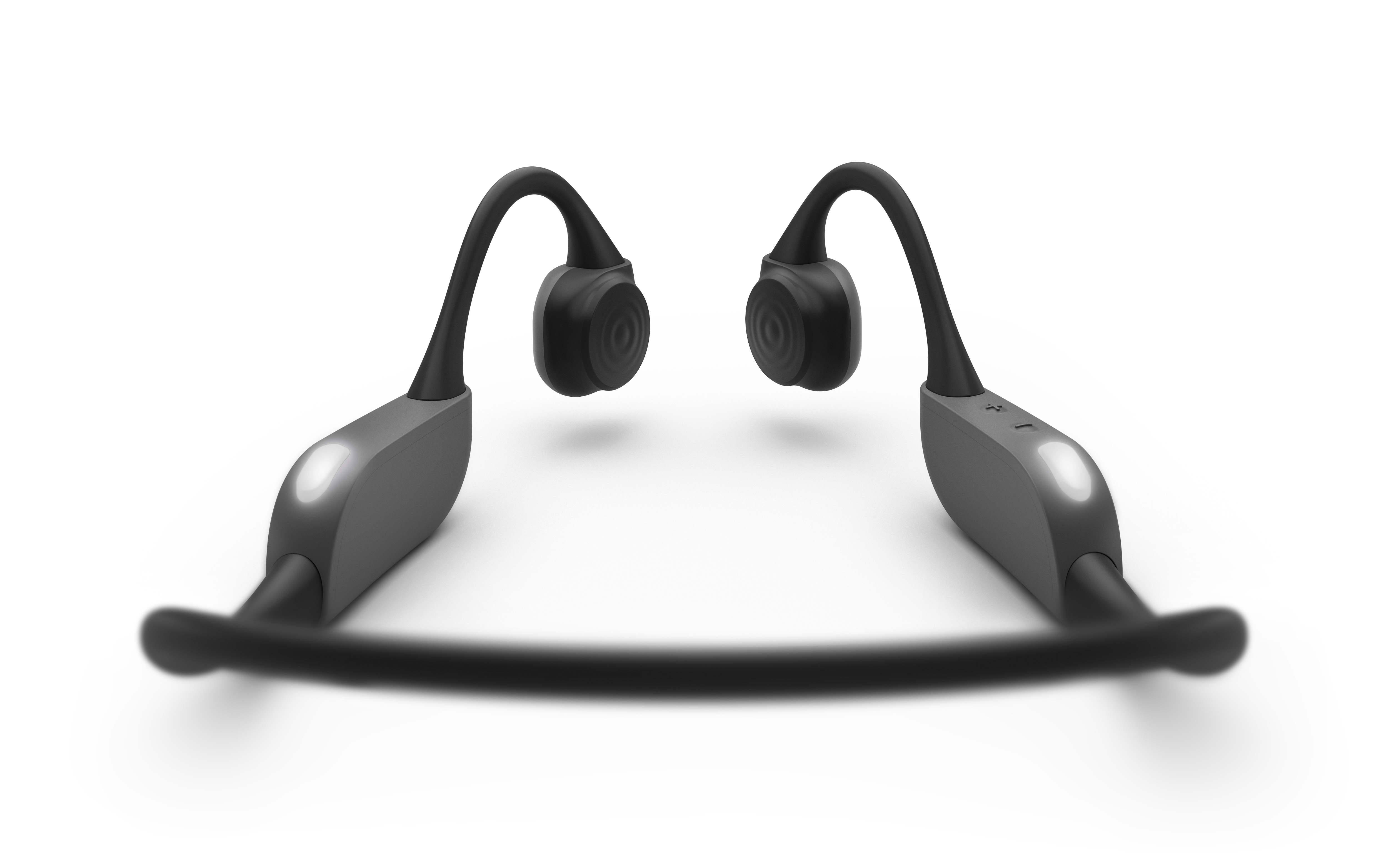 Auriculares de conducción ósea negros y grises, aislados sobre fondo blanco.