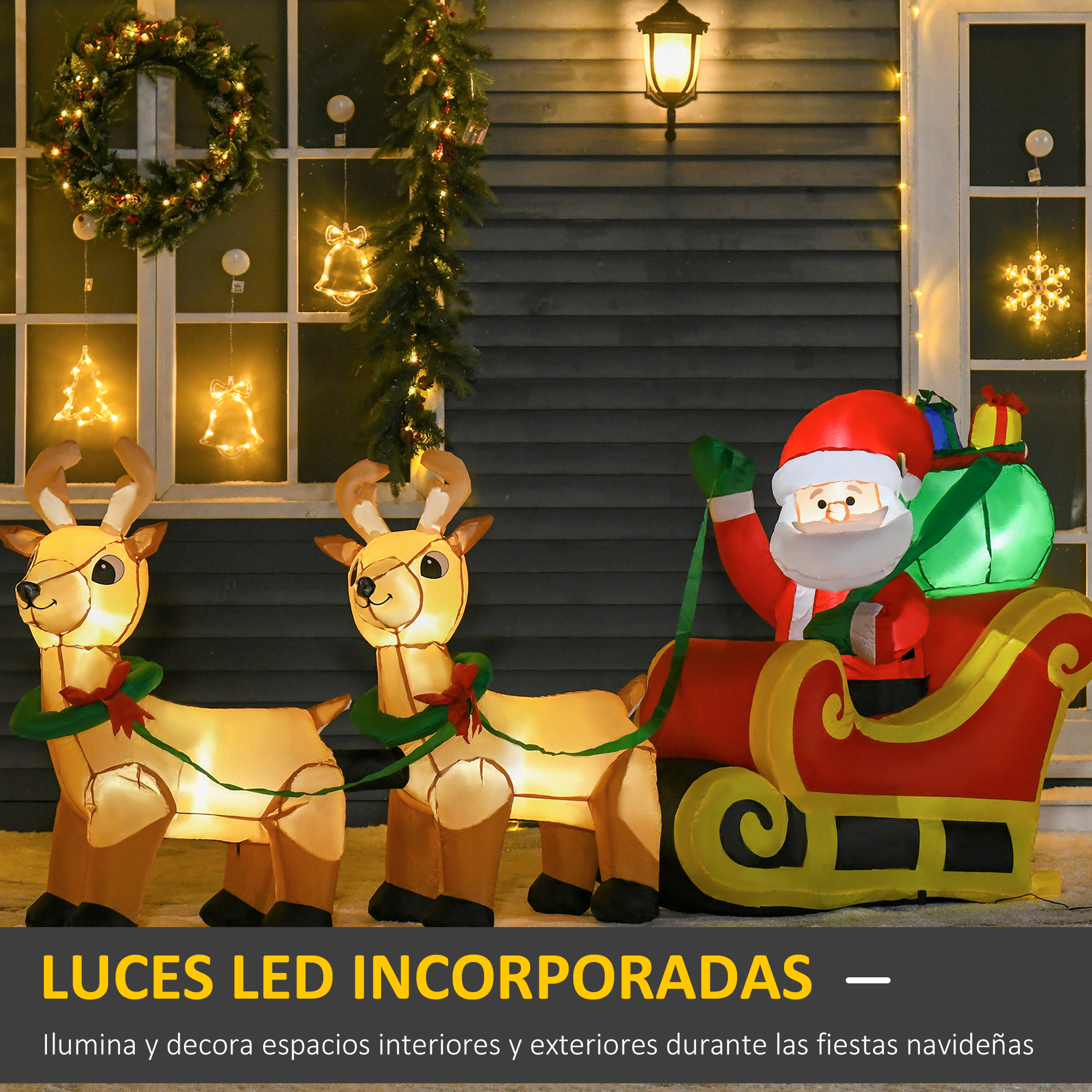 Exhibición navideña con Santa en trineo, renos y luces. El letrero dice 'LUCES LED INCORPORADAS'.