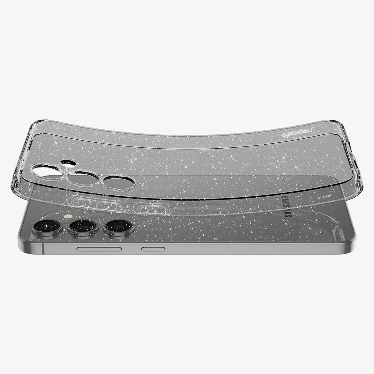 Un téléphone avec une coque à paillettes est posé sur un autre téléphone.