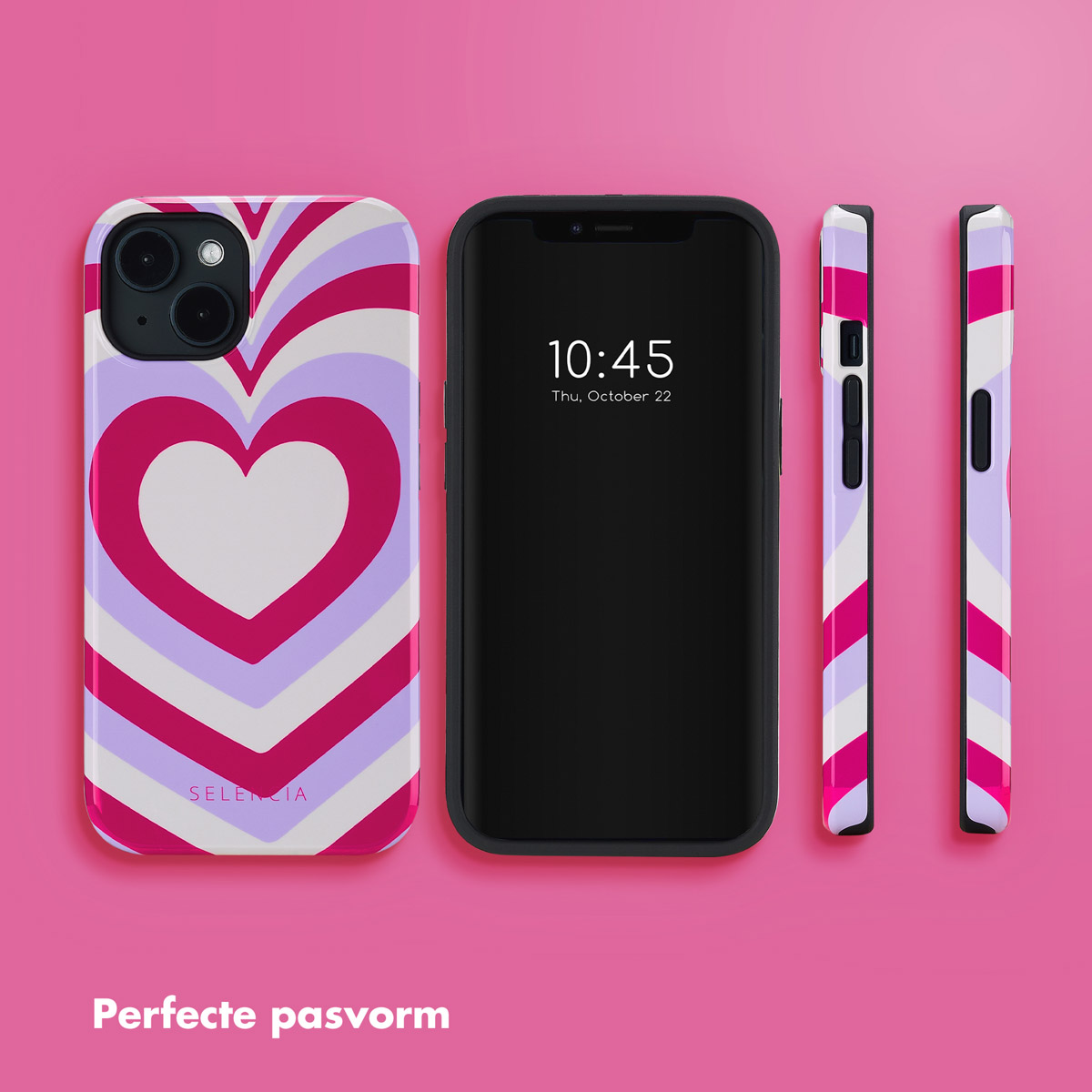 Een telefoon in een hartvormige hoes naast een telefoon met tijd en datum, op een roze oppervlak.