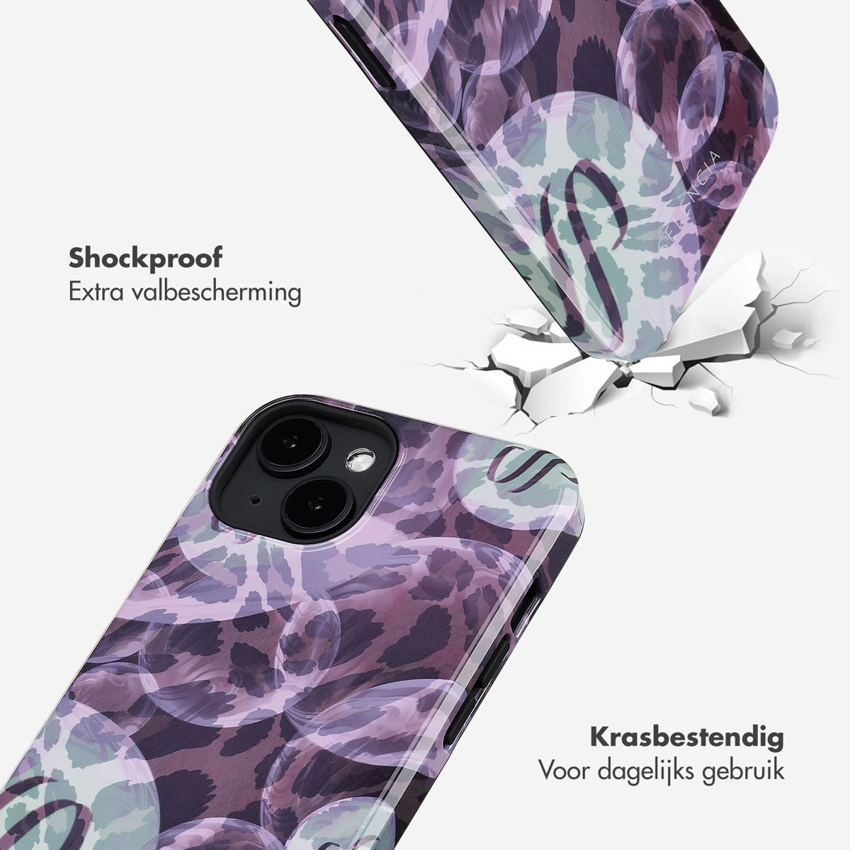 Telefoonhoesje met bloemenpatroon dat valt, scheuren verschijnen rond de impactzone.