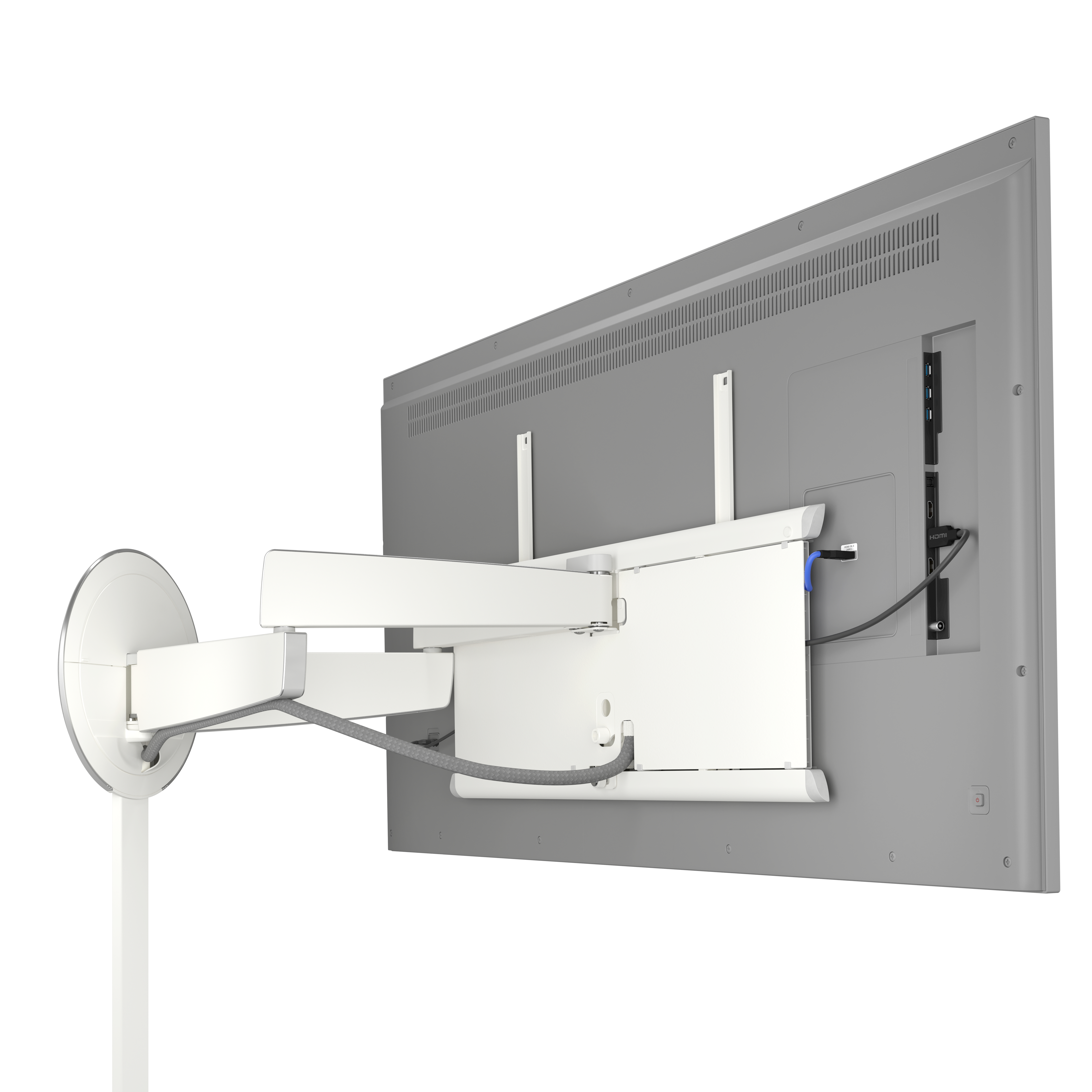 Telewizor zamontowany na białym wsporniku. Kable są podłączone. Wspornik jest zamontowany na białej ścianie.