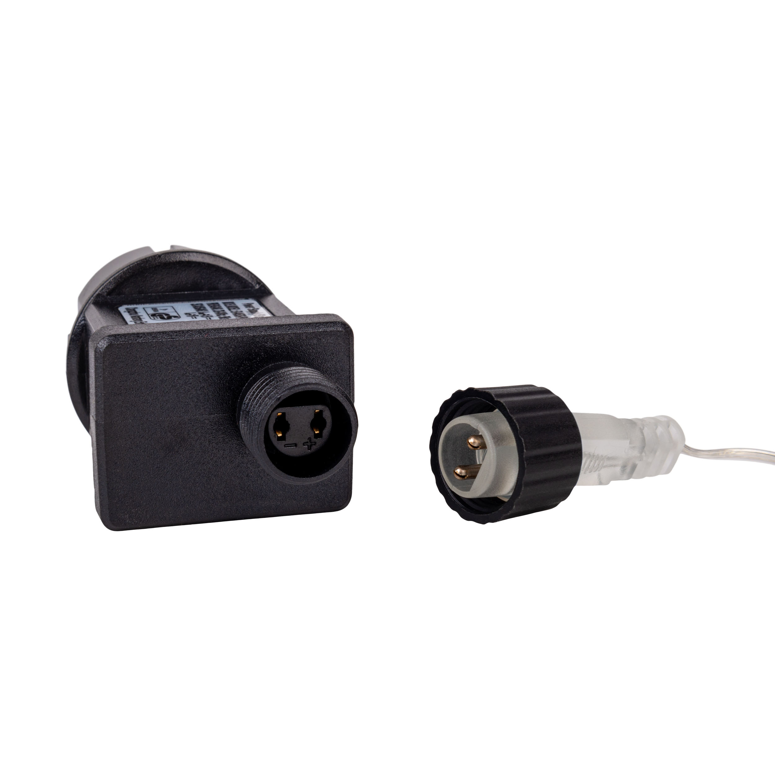 Schwarz-weißer zweiteiliger Stecker mit Netzstecker und Buchse zum Verbinden.