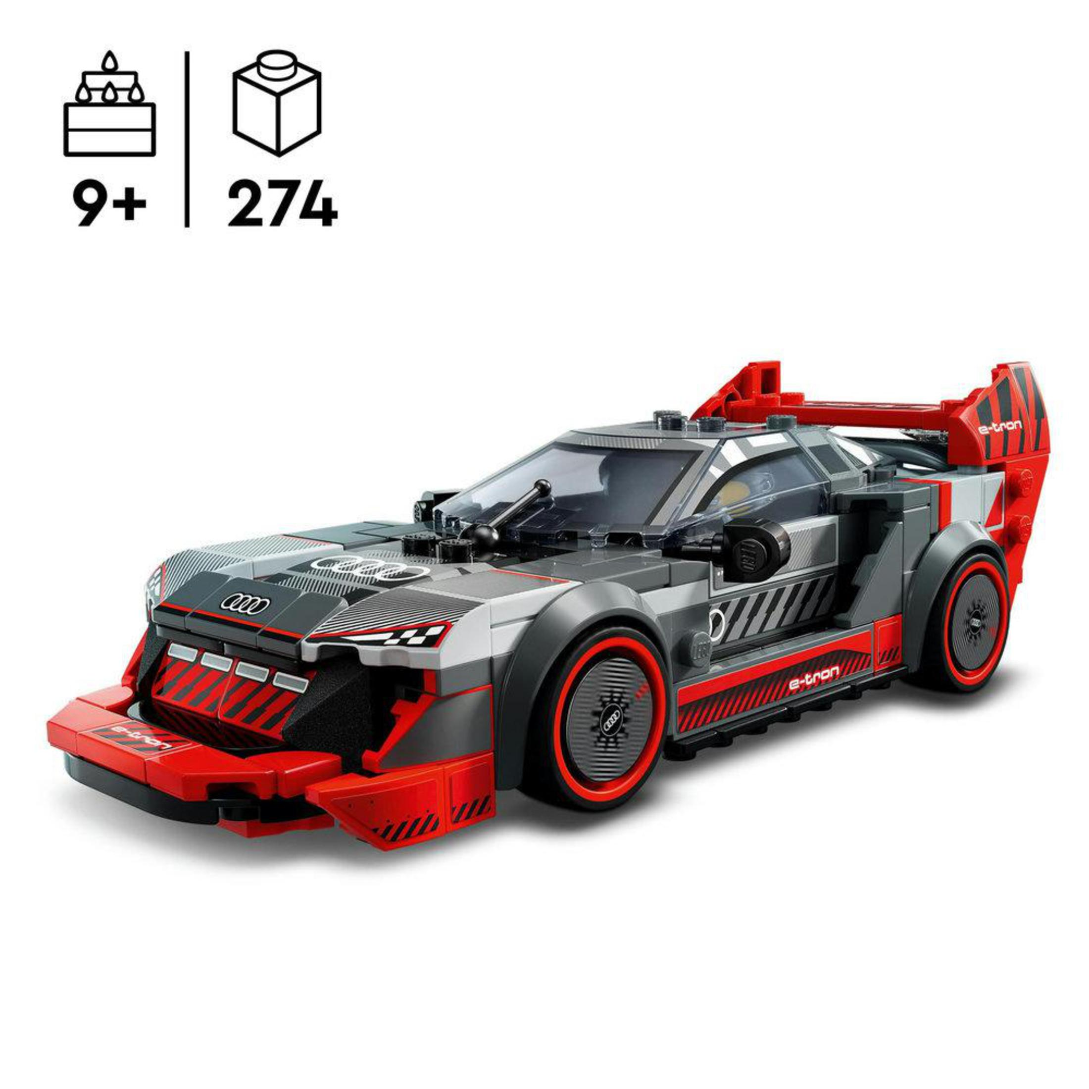 Model samochodu Lego Audi e-tron, szary z czerwonymi akcentami. Widoczne części i pudełko.