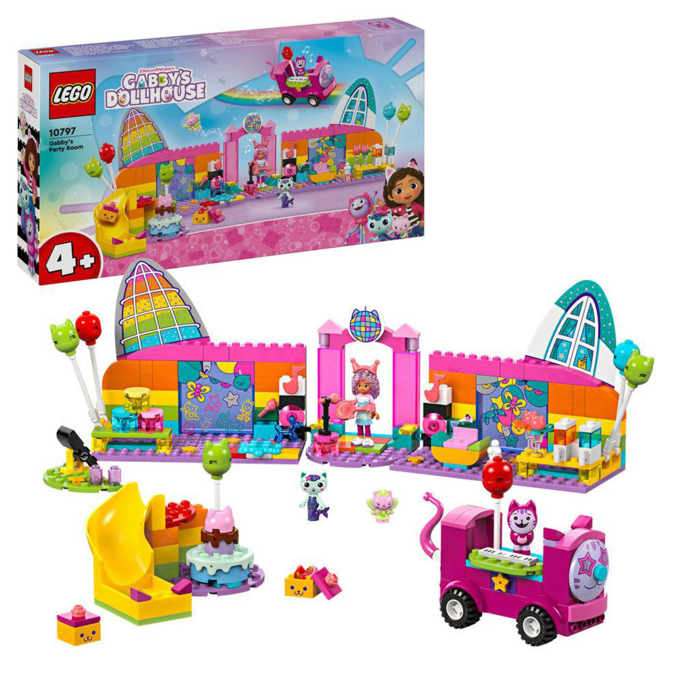 Lego Gabby's Dollhouse seti. Görüntüde, bir kaydırak, tren ve çeşitli Lego figürleriyle pembe bir oyuncak ev görülüyor.