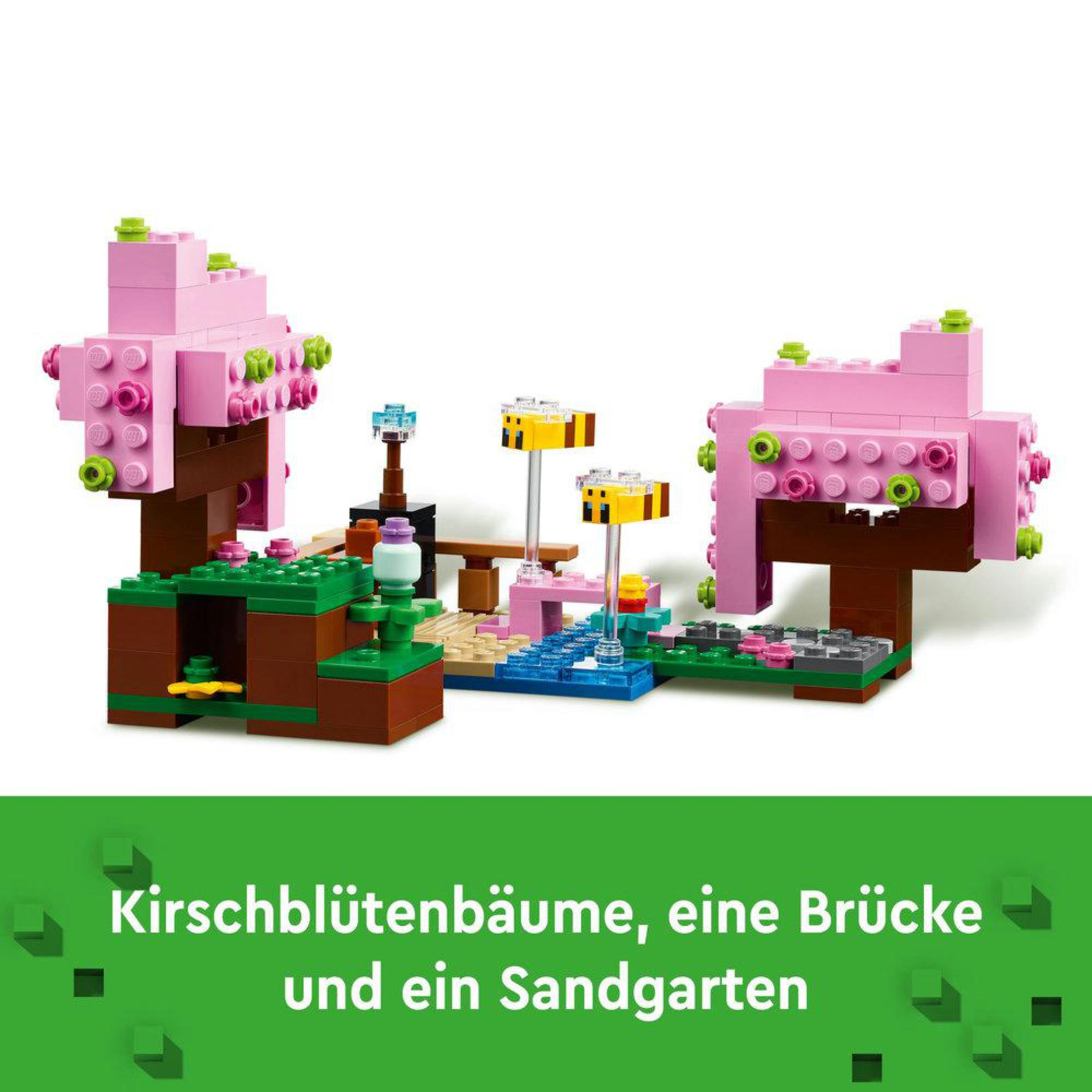 Een Lego-model van een roze kersenbloesemboom, brug en zandtuin.