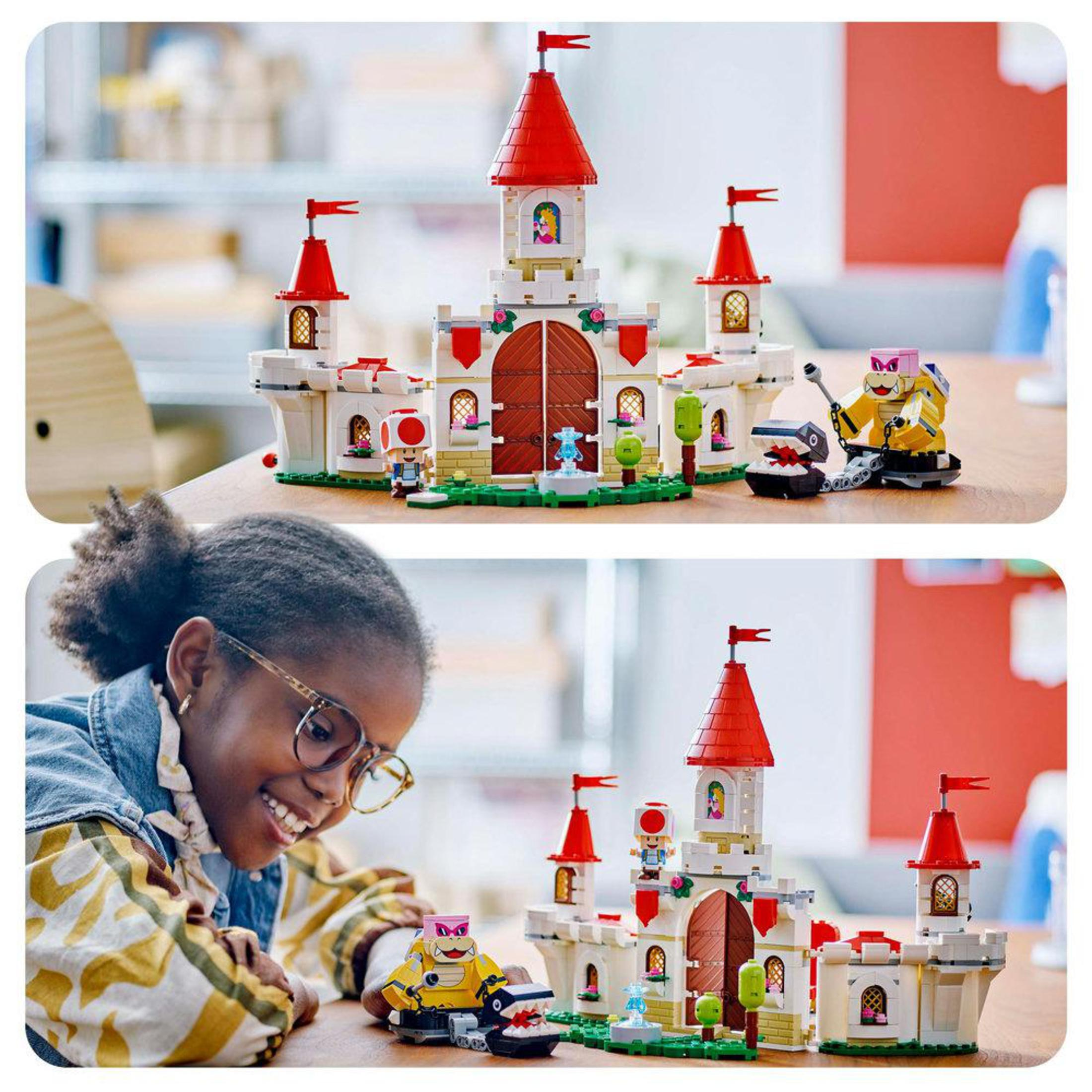 Lego-Set mit Burg, Figuren und einem Kind, das es baut.