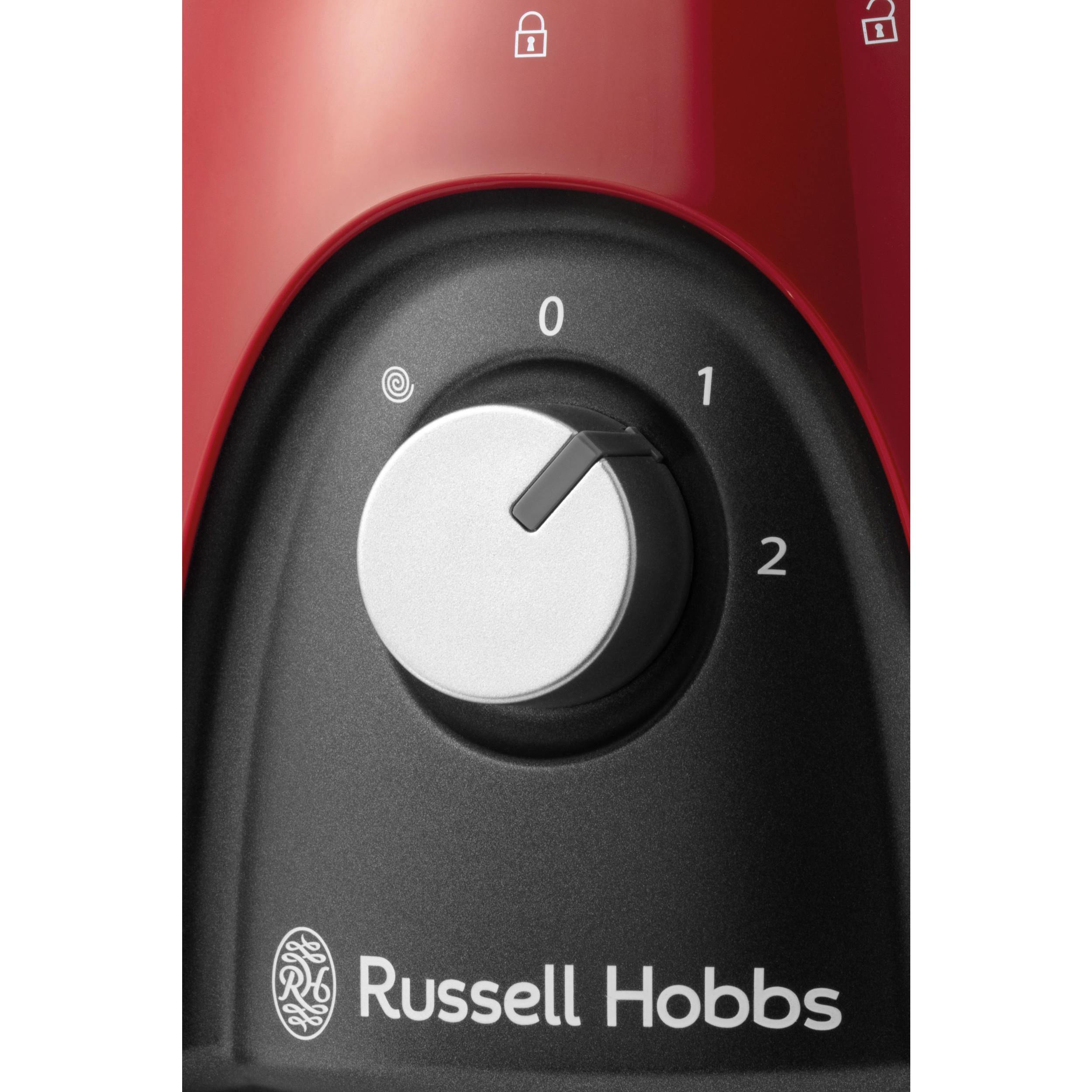 Primo piano della manopola di controllo di un frullatore, corpo rosso, con i numeri 0, 1, 2. Il marchio è Russell Hobbs.