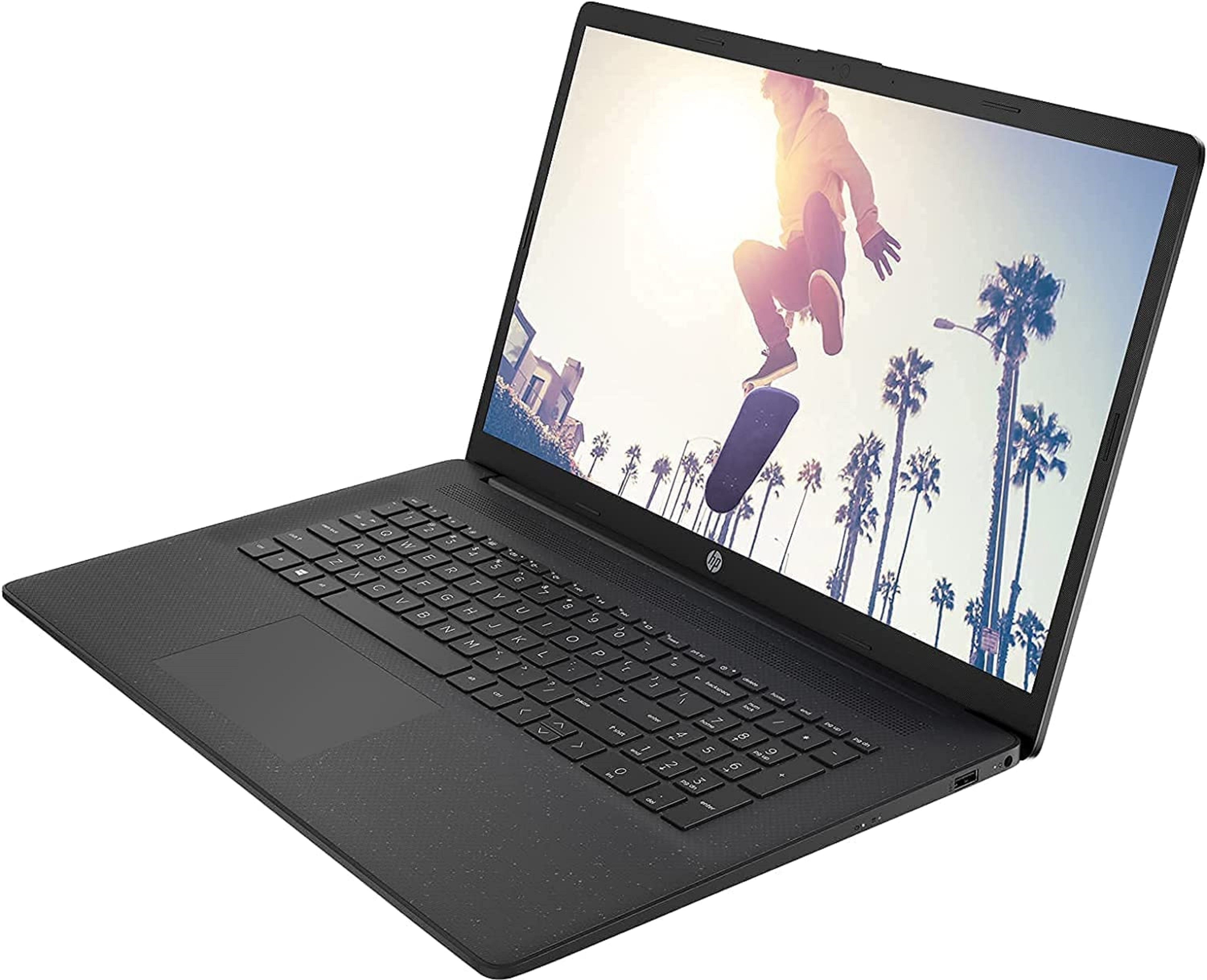 Ein schwarzer Laptop mit einem Skateboarder in einer Stadt mit Palmen. Die Tastatur ist sichtbar.