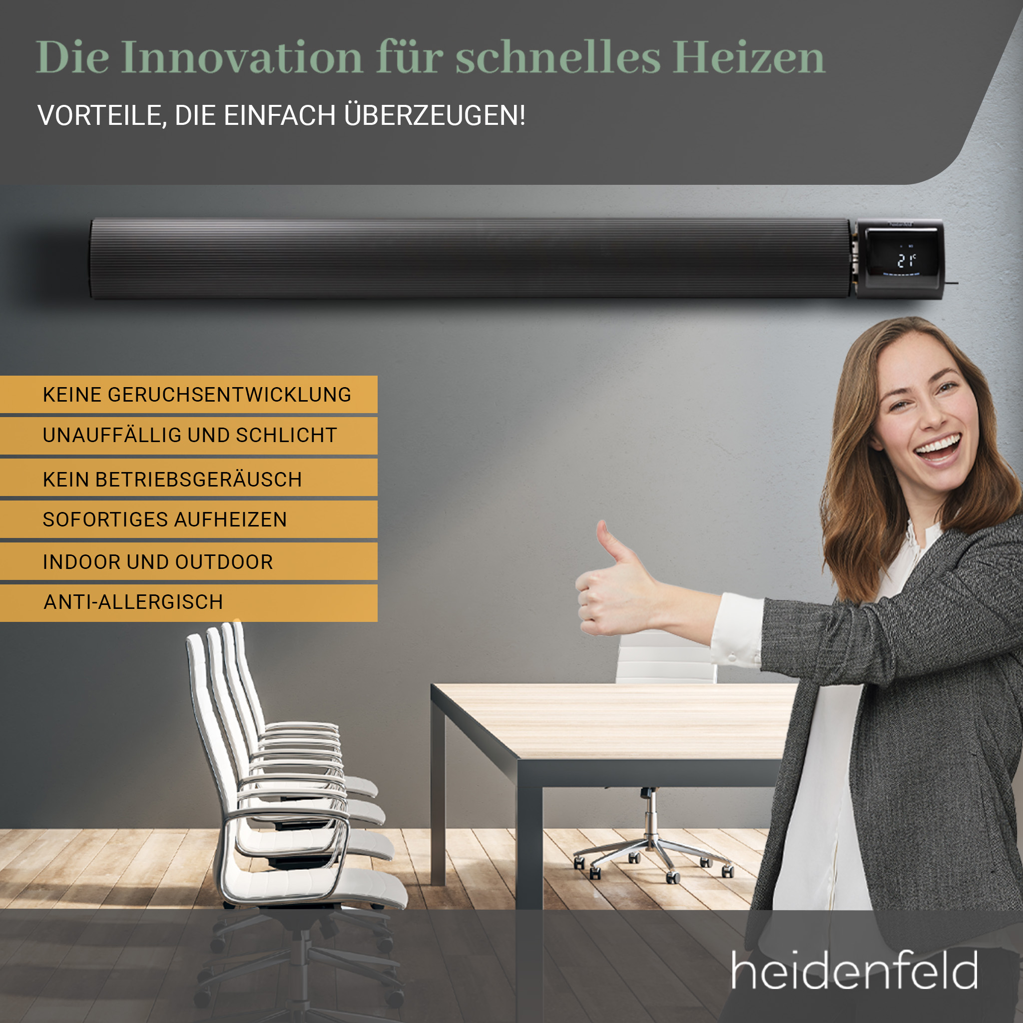 Eine Frau lächelt neben einem Heizgerät mit Schreibtisch und Stühlen vor einer Wand.