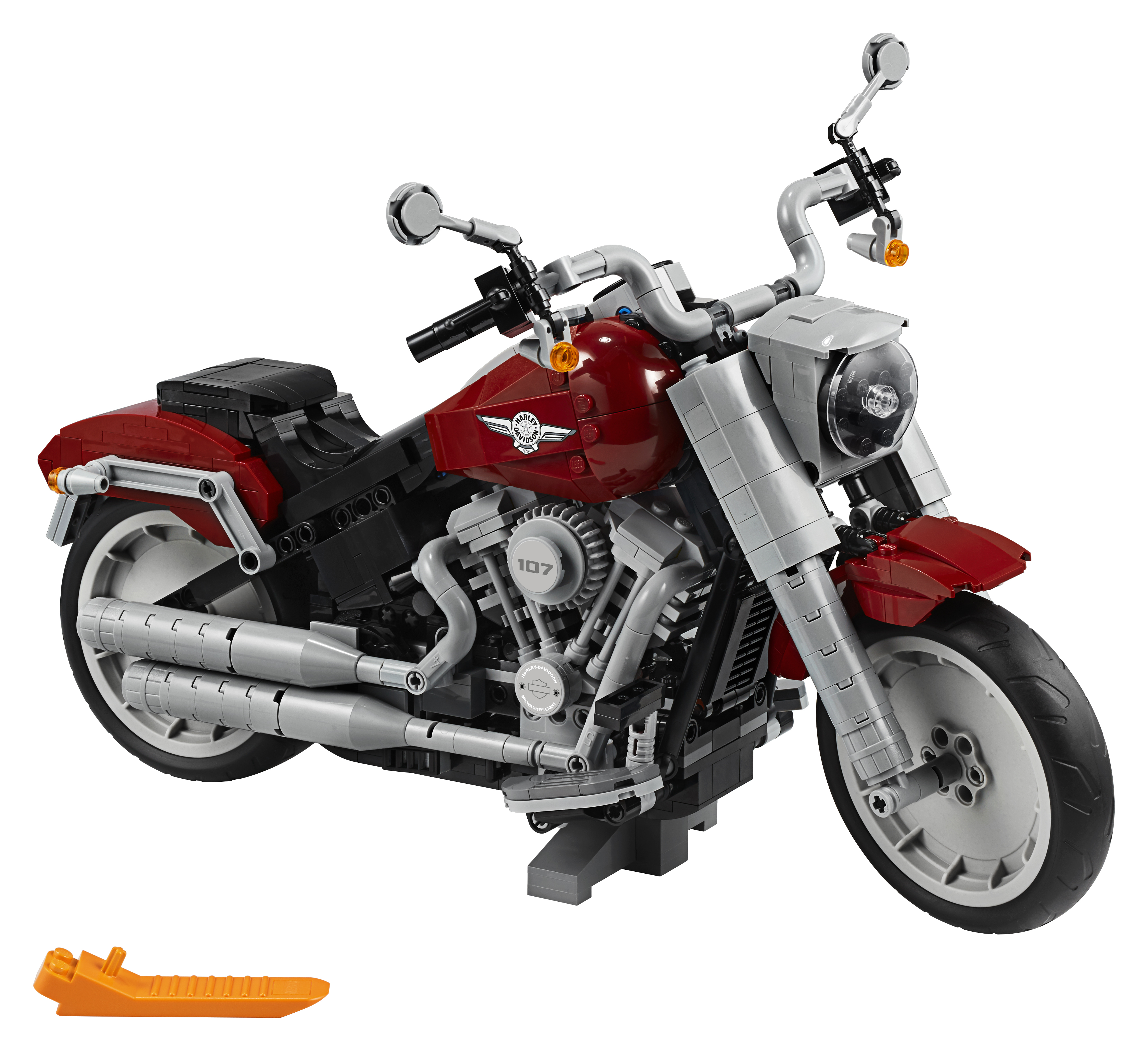 Ein rotes und schwarzes Lego-Motorradmodell mit orangen Teilen.