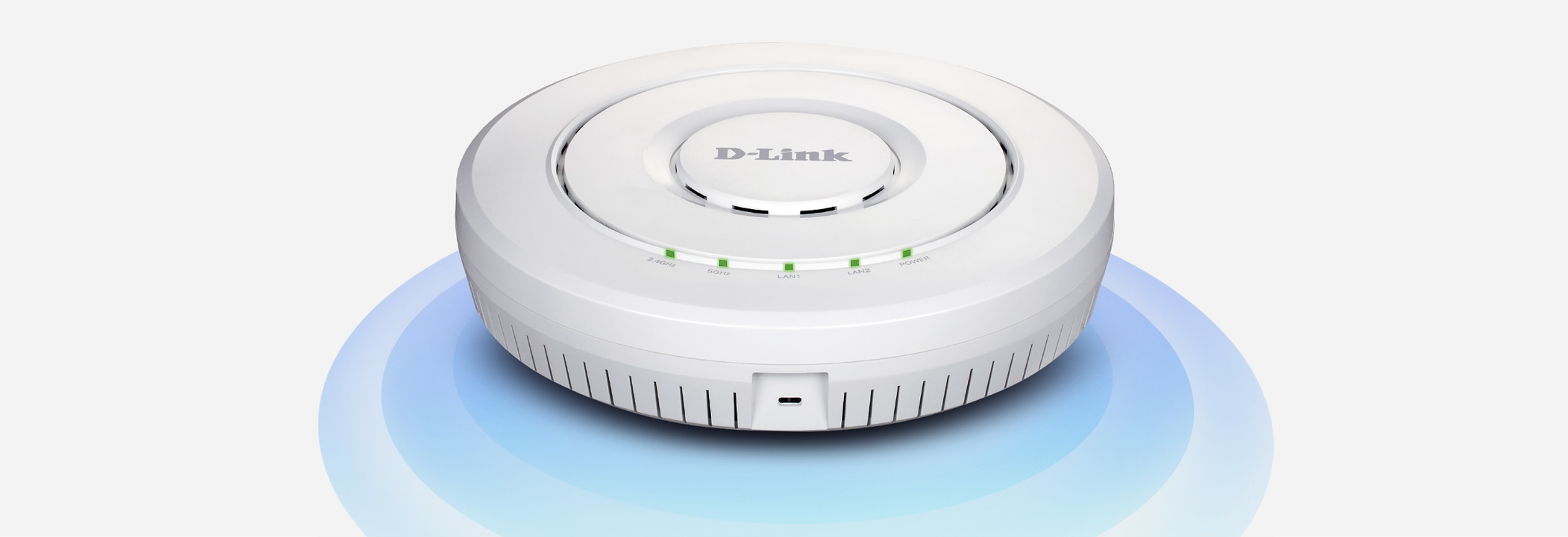 Punto de acceso Wi-Fi D-Link blanco con luces indicadoras verdes, sobre base azul.