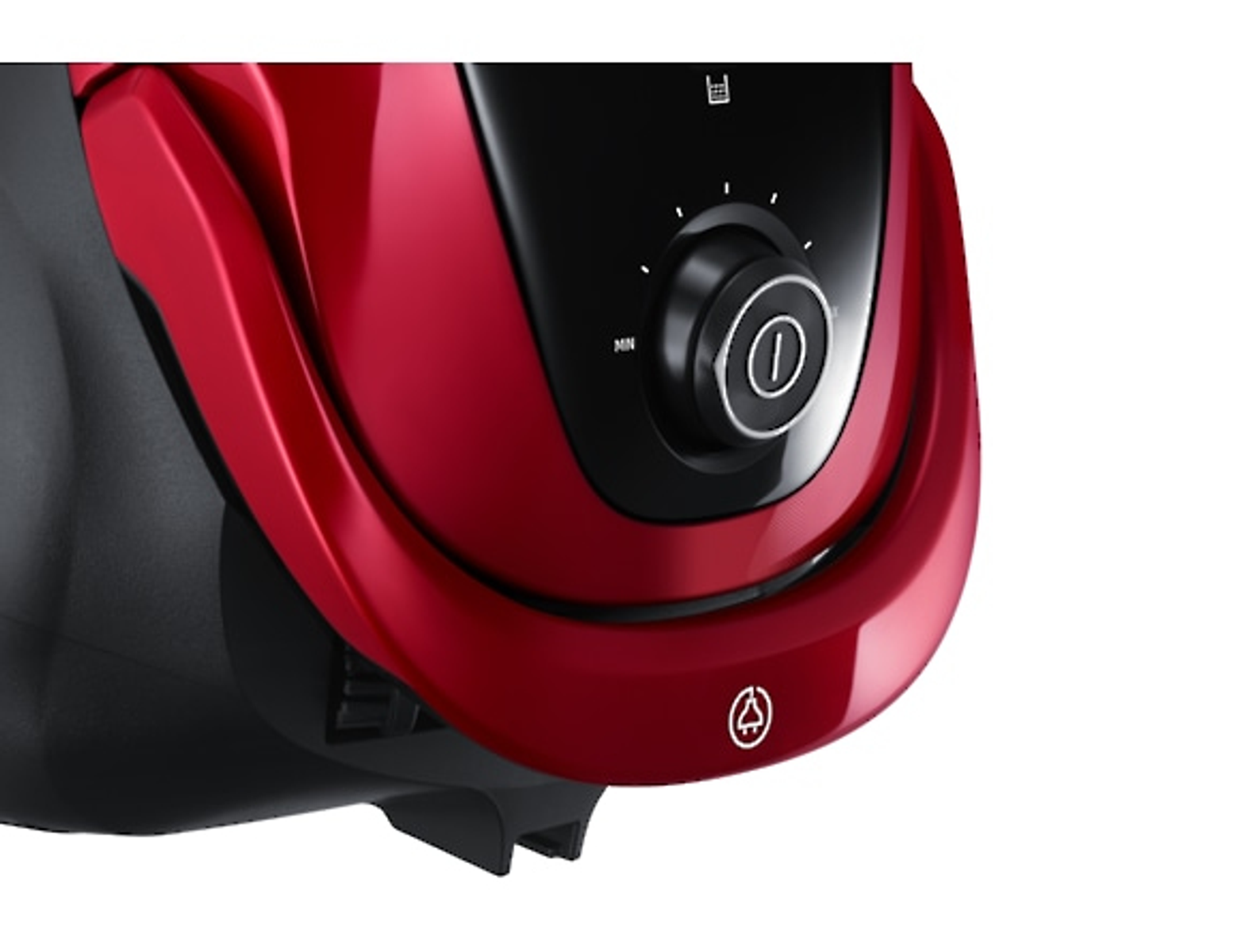 Zbliżenie czerwonego odkurzacza z czarnym pokrętłem i białym logo.