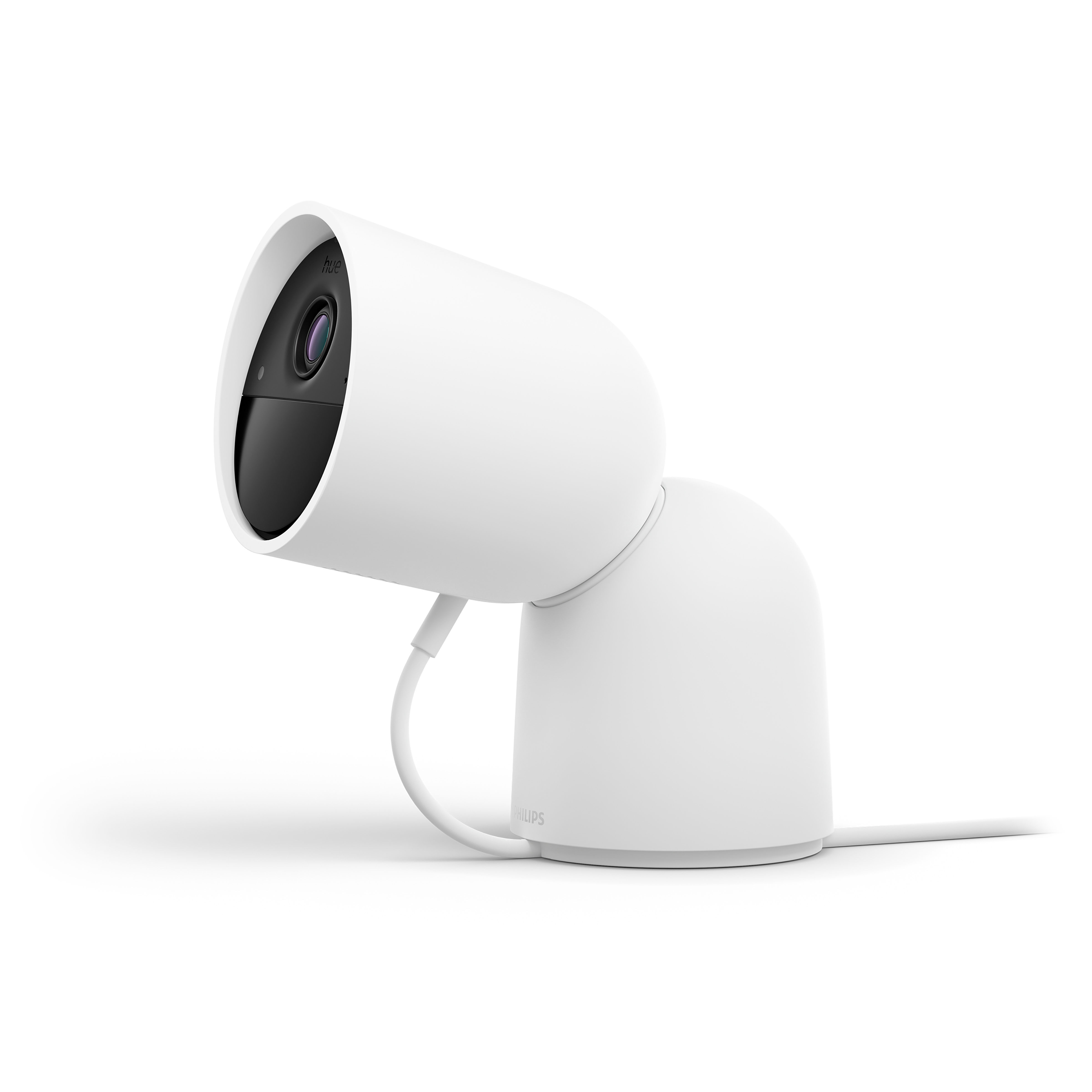 White, rounded Philips home security camera on a white surface. The camera is angled to the left.