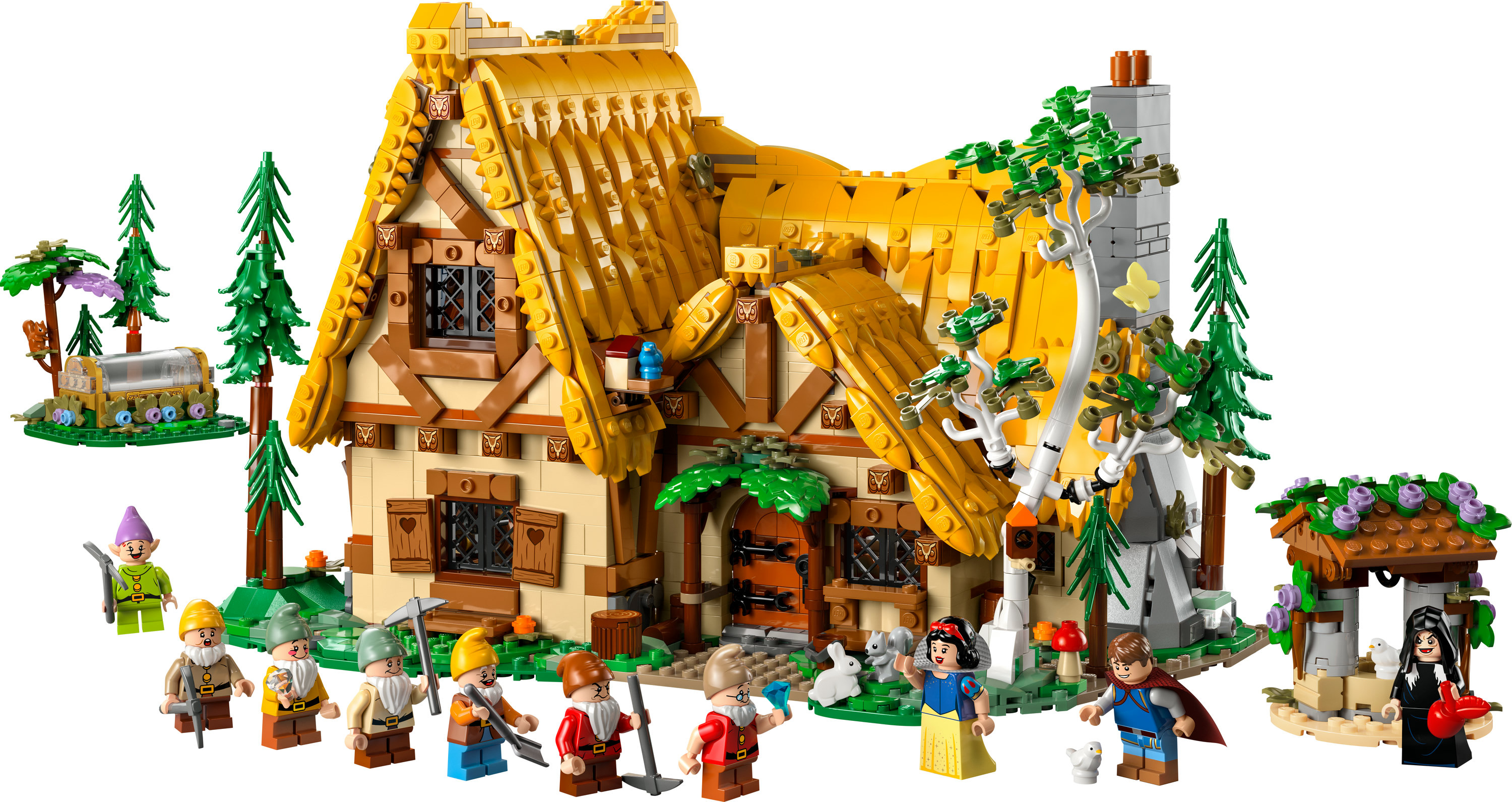 Ensemble de la cabane de Blanche-Neige LEGO avec figurines, arbres, puits. Fond blanc.