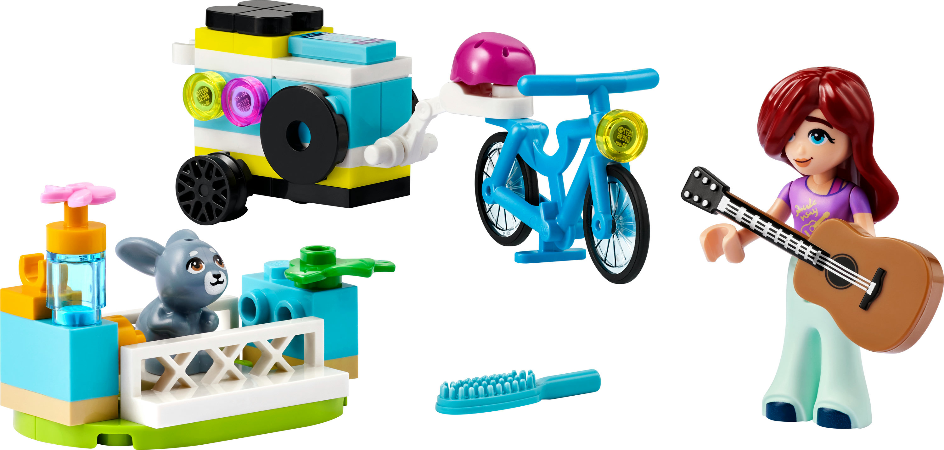 Set Lego Friends avec un vélo, une fille jouant de la guitare et des accessoires.