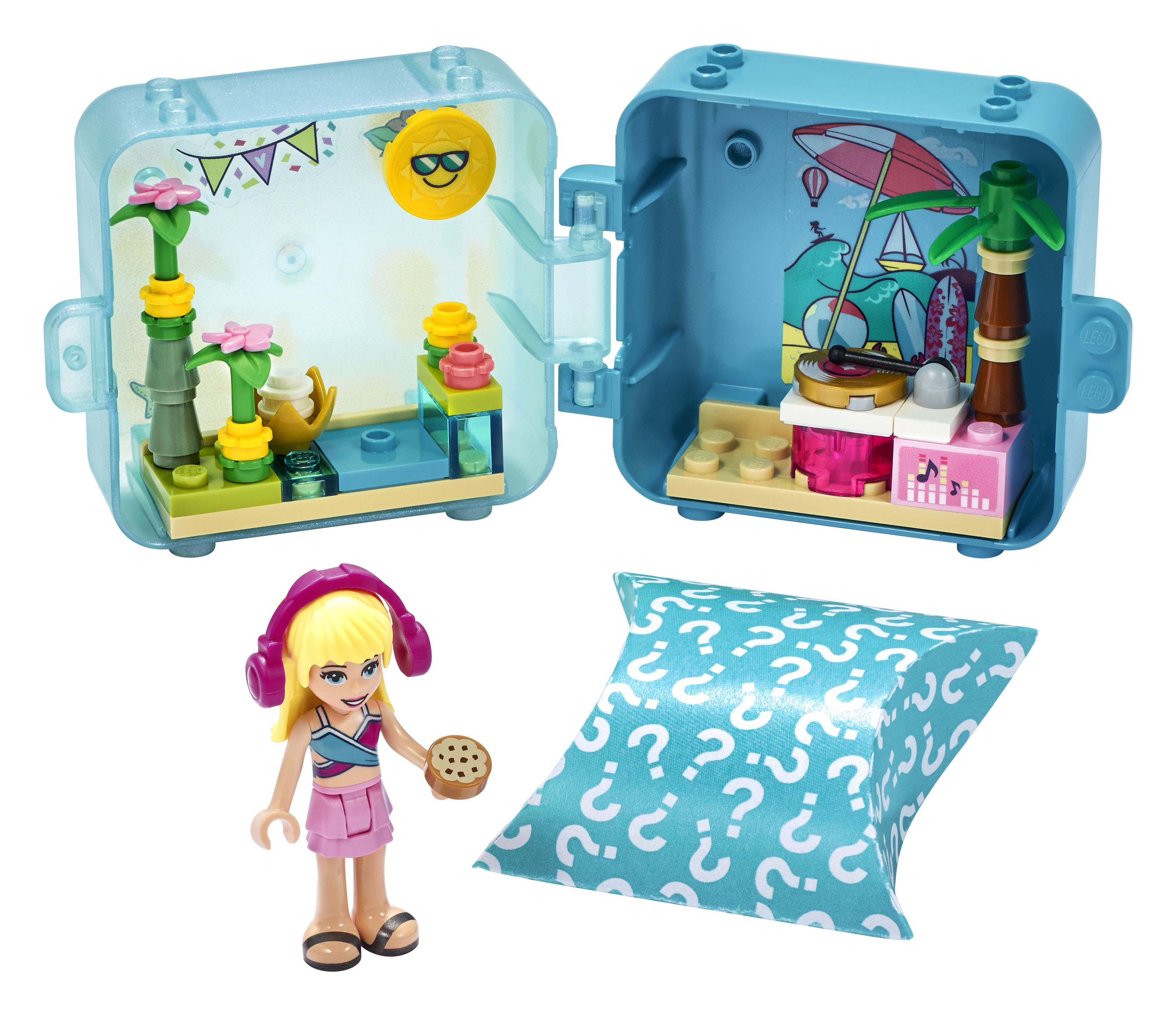 Zestaw Lego Friends. Dziewczyna ze słuchawkami i ciastkiem. Otwarta niebieska kostka z wnętrzem.