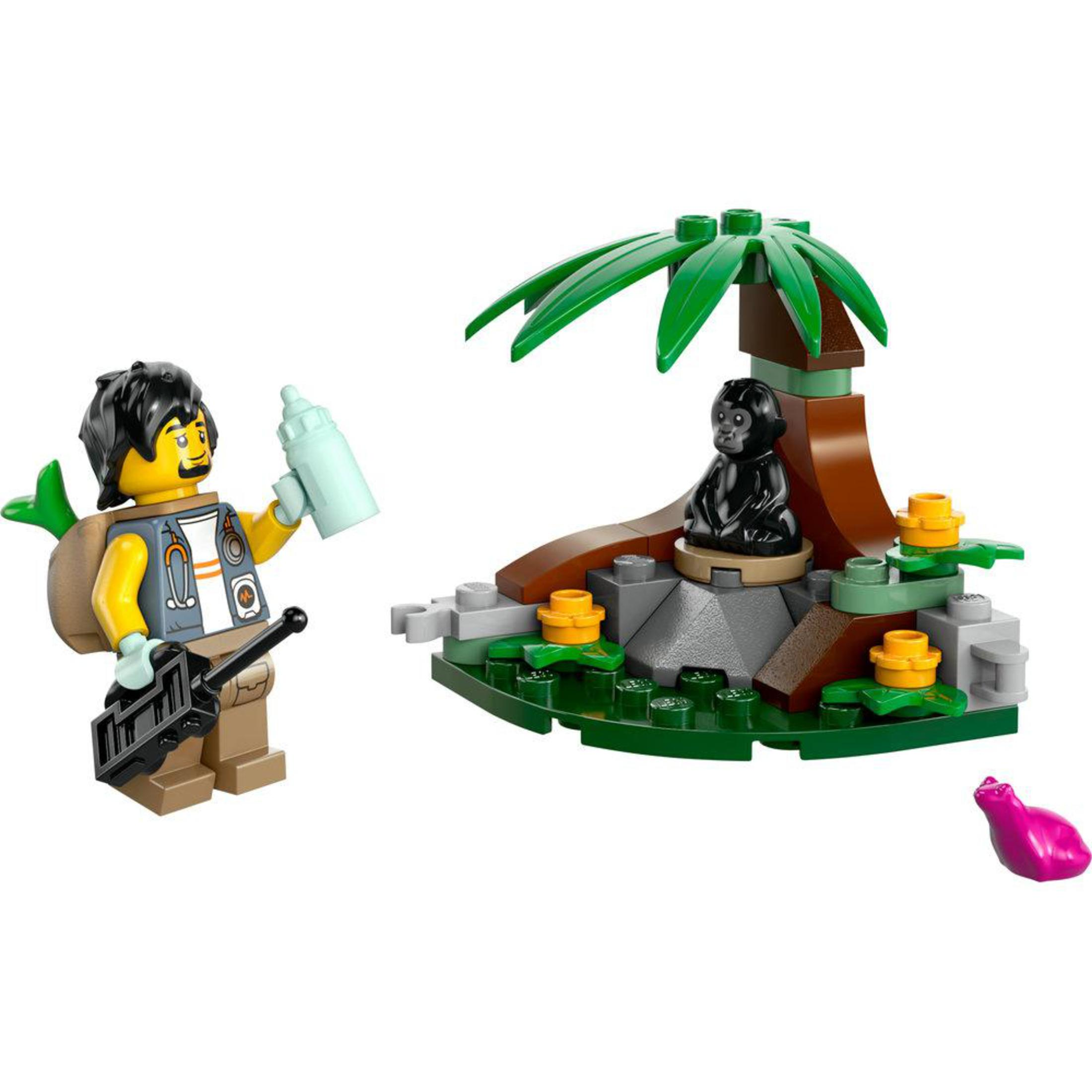 Lego-Set mit einem Mann, einem Affen im Baum und einem rosa Objekt.