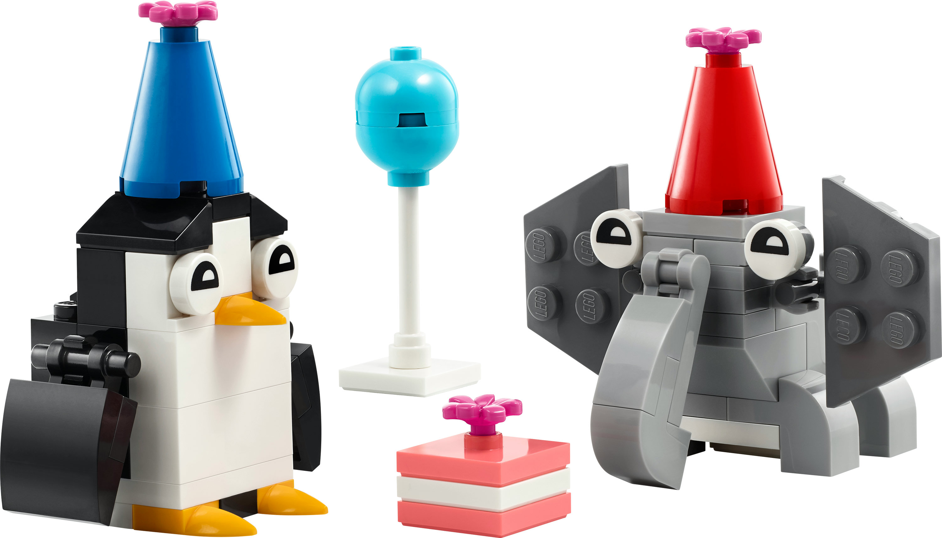 LEGO seti: Parti şapkaları, pasta ve mavi topla penguen ve fil yapıları. Beyaz zemin.